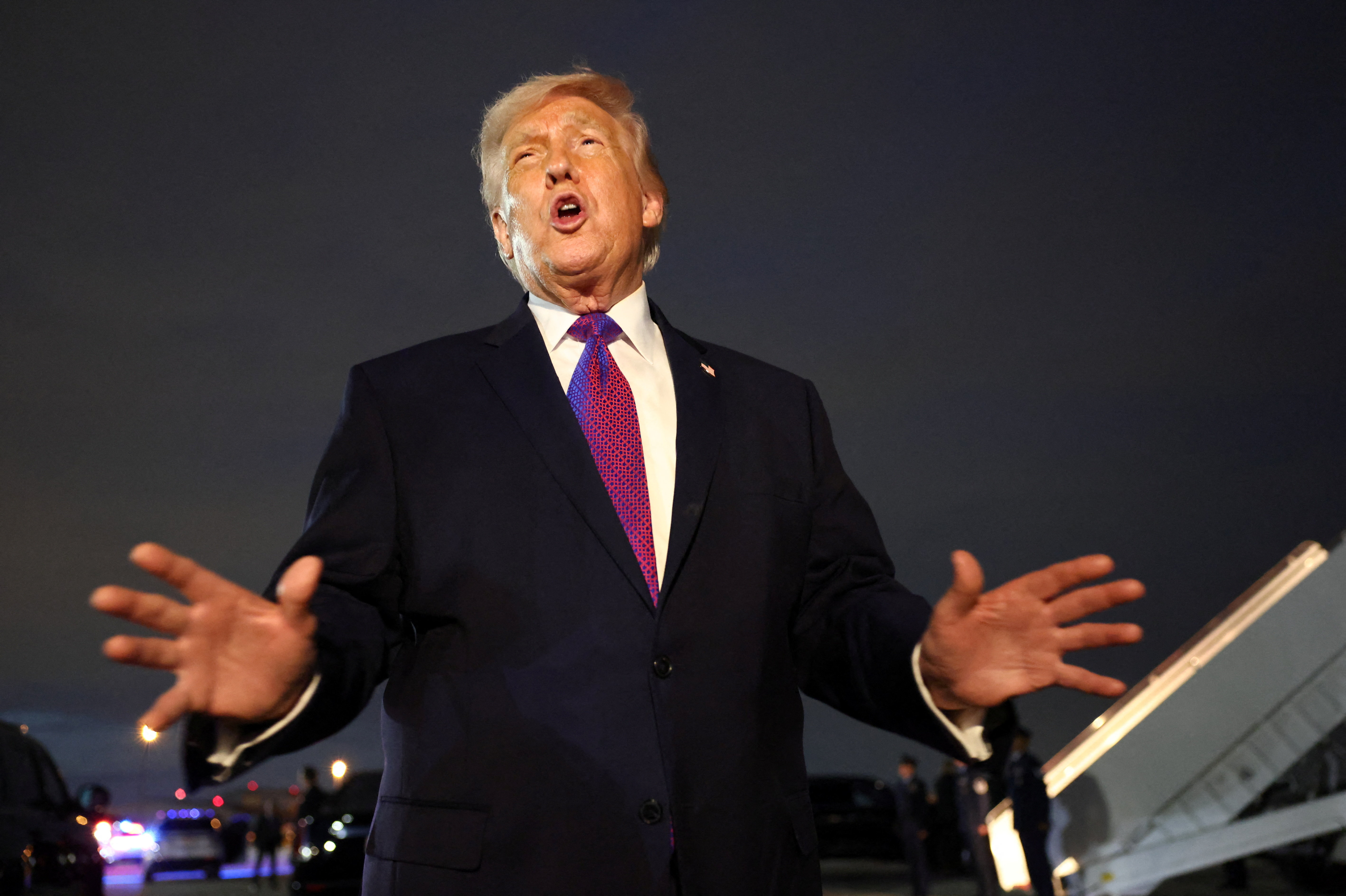 U.S. President Donald Trump talks to the media upon his arrival at Joint Base Andrews, Maryland, U.S., March 11, 2026.