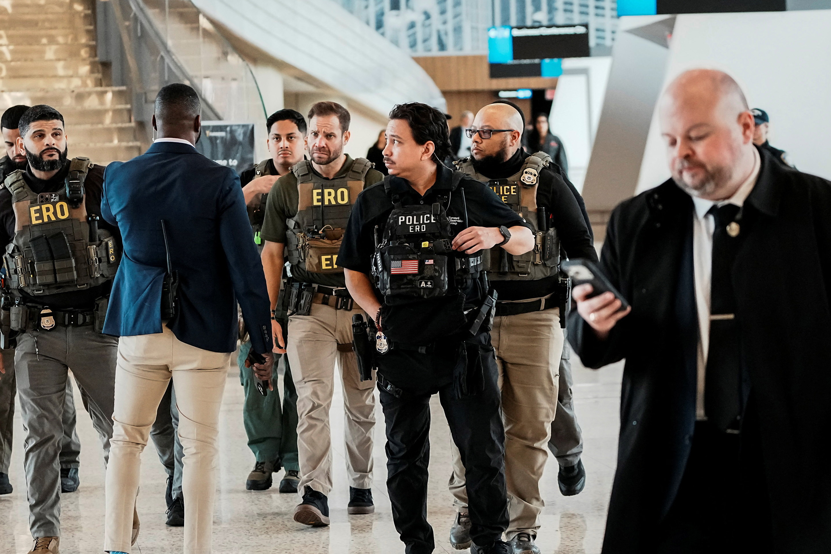 Immigration and Customs Enforcement (ICE) agents patrol at LaGuardia International Airport, New York City, U.S. March 23, 2026. [Eduardo Munoz/Reuters]