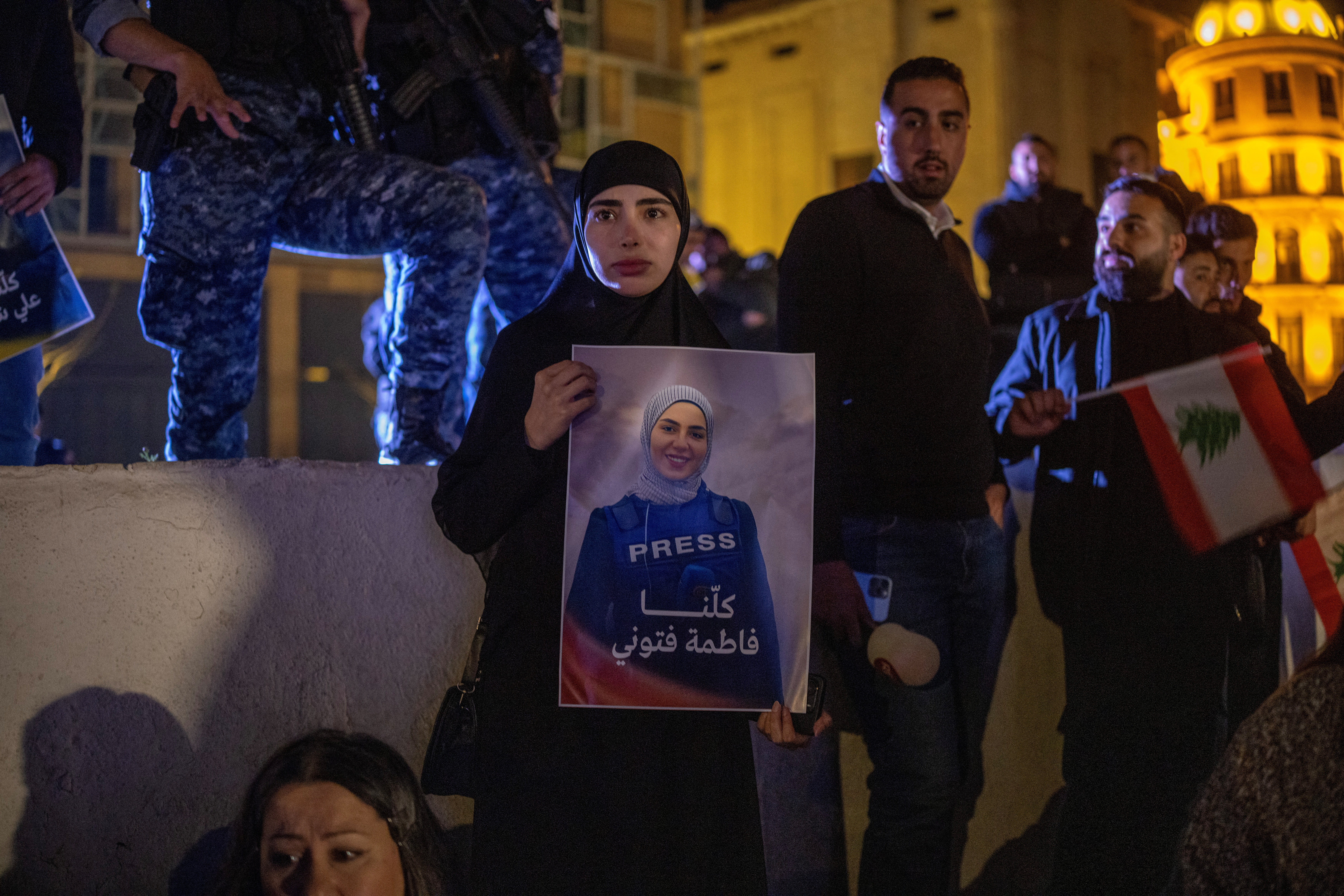 A woman holds a photo of Lebanese Al Mayadeen reporter Fatima Ftouni during a demonstration following her killing along with Al Manar reporter Ali Shaib and cameraman Mohammed Ftouni by a targeted Israeli strike, amid escalating hostilities between Israel and Hezbollah, as the U.S.-Israeli conflict with Iran continues, in Beirut, Lebanon, March 28, 2026. REUTERS/Alkis Konstantinidis