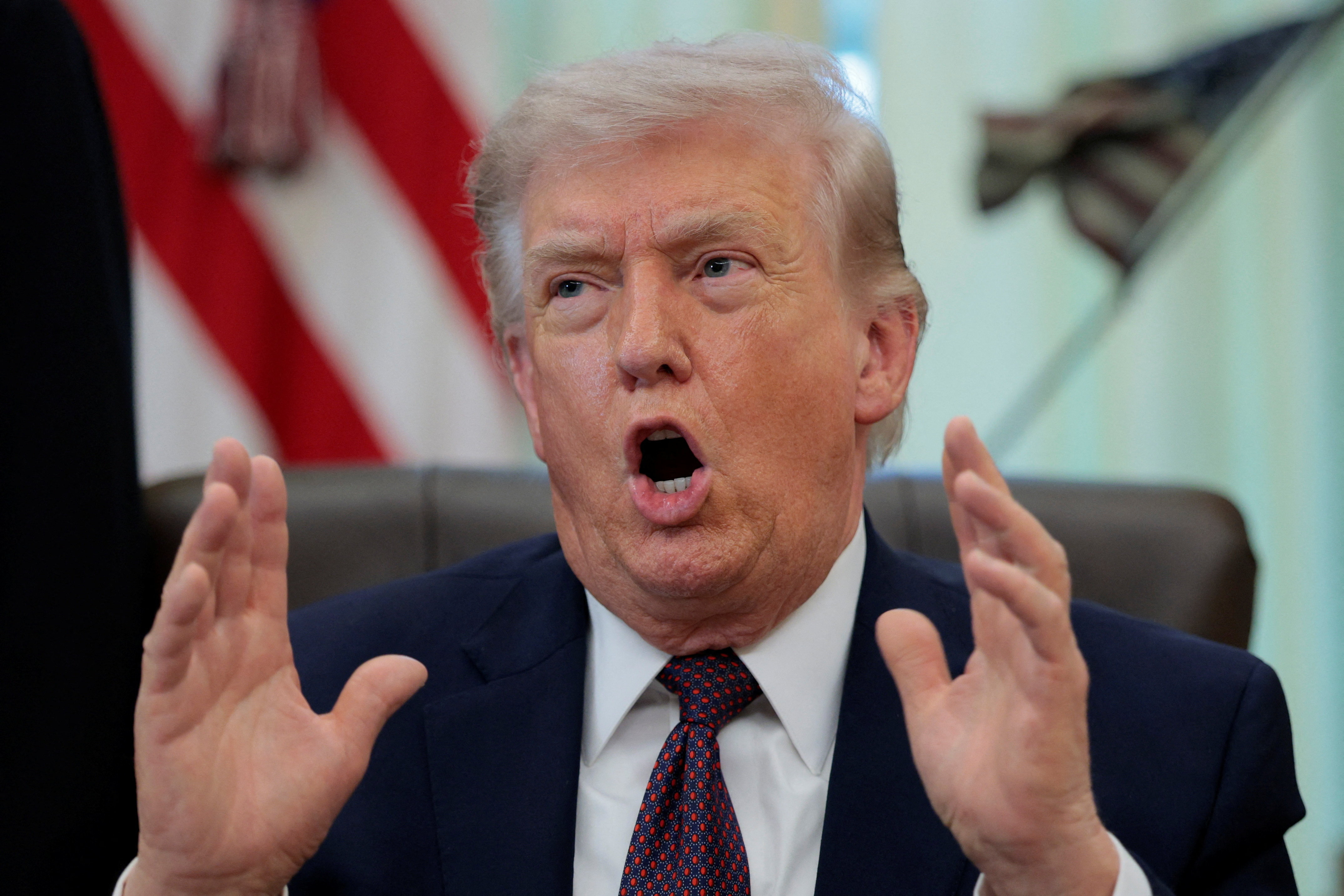 U.S. President Trump signs an executive order in the Oval Office of the White House