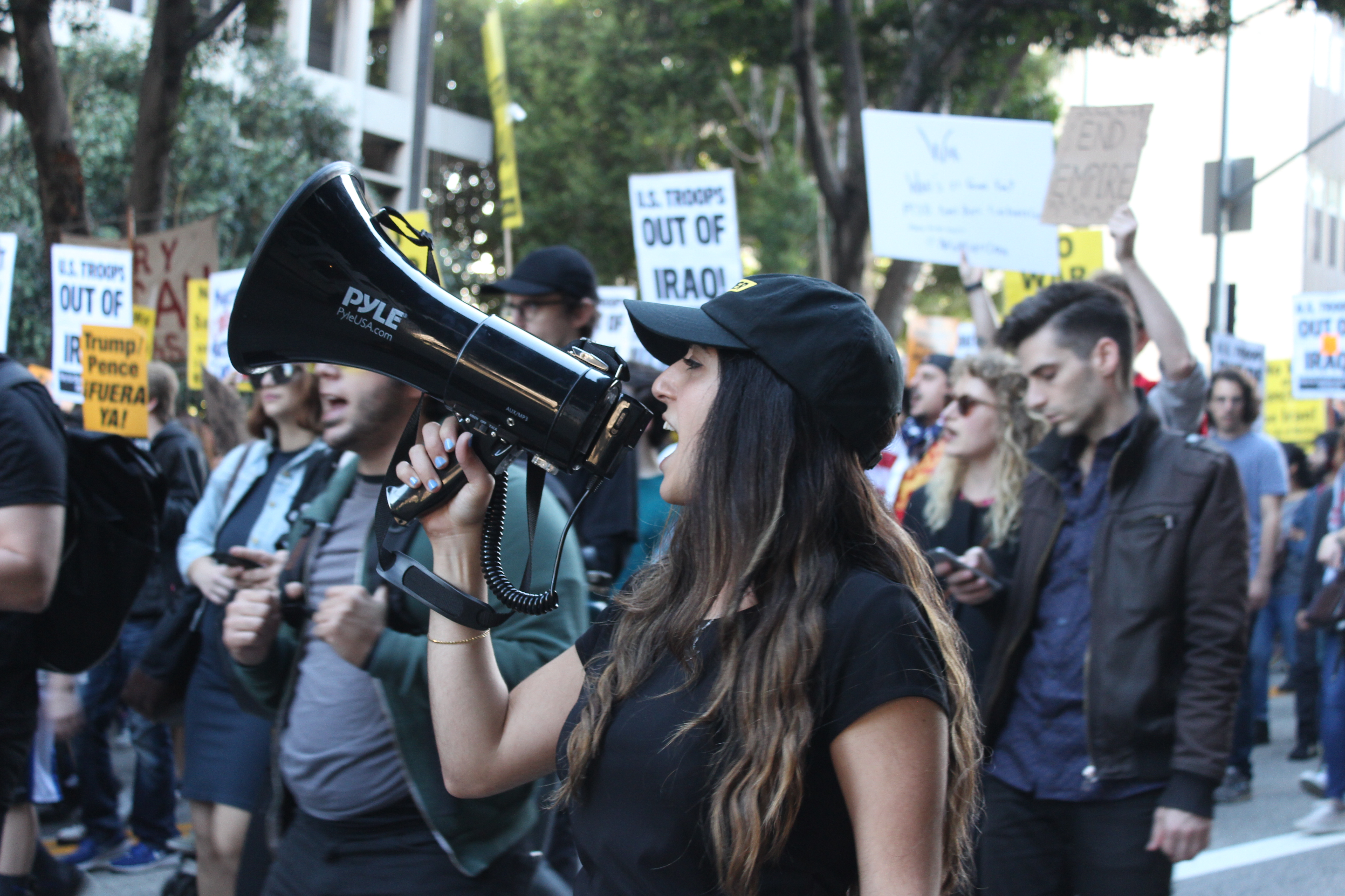A woman speaks into a megaphone