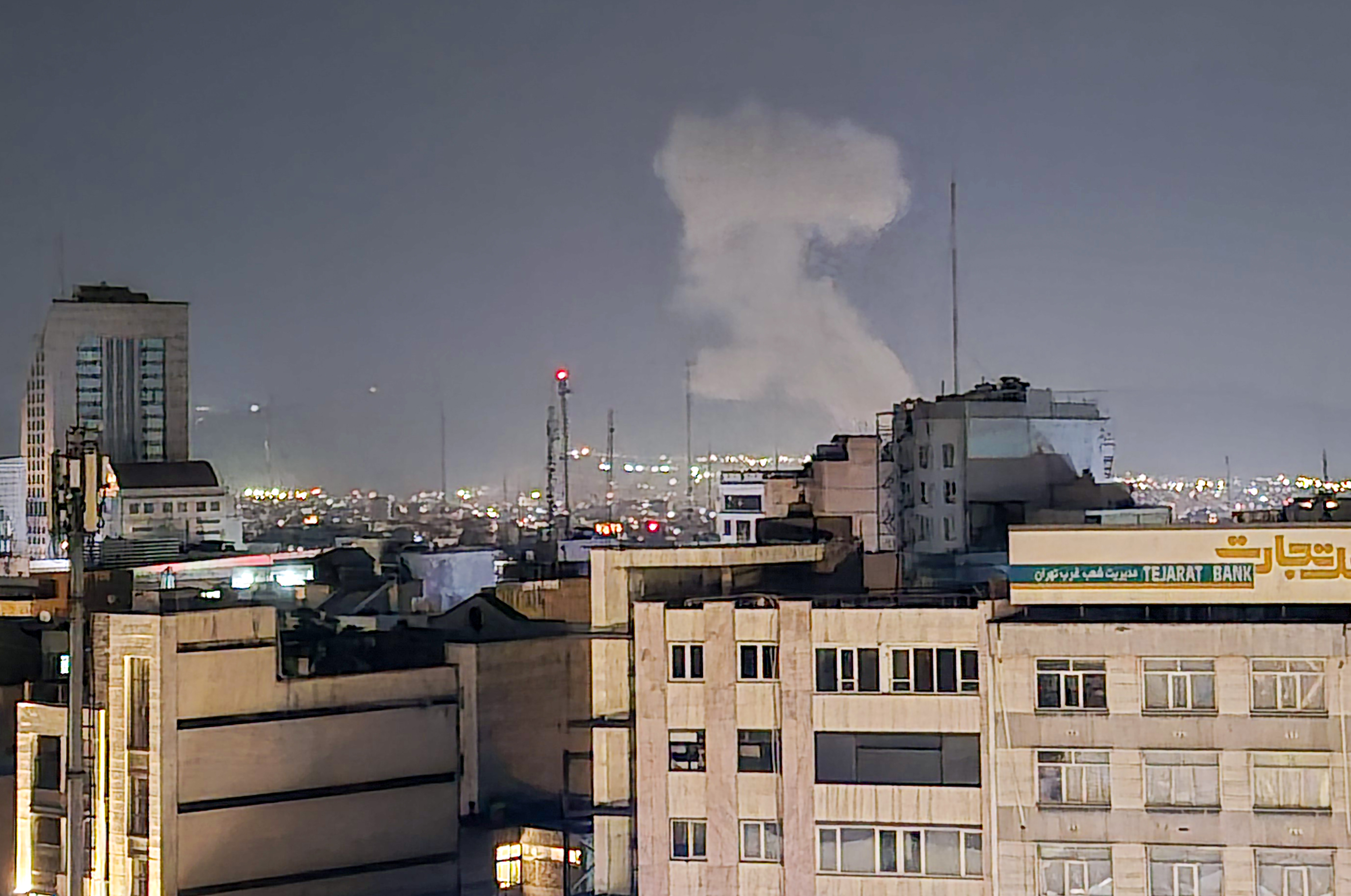 Smoke rises after explosions as the Israeli army announced a new wave of attacks on Tehran