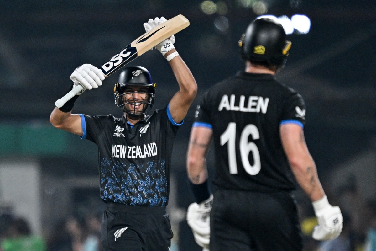 New Zealand's Rachin Ravindra (L) and Finn Allen celebrate their team's win at the end of the 2026 ICC Men's T20 Cricket World Cup semi-final match