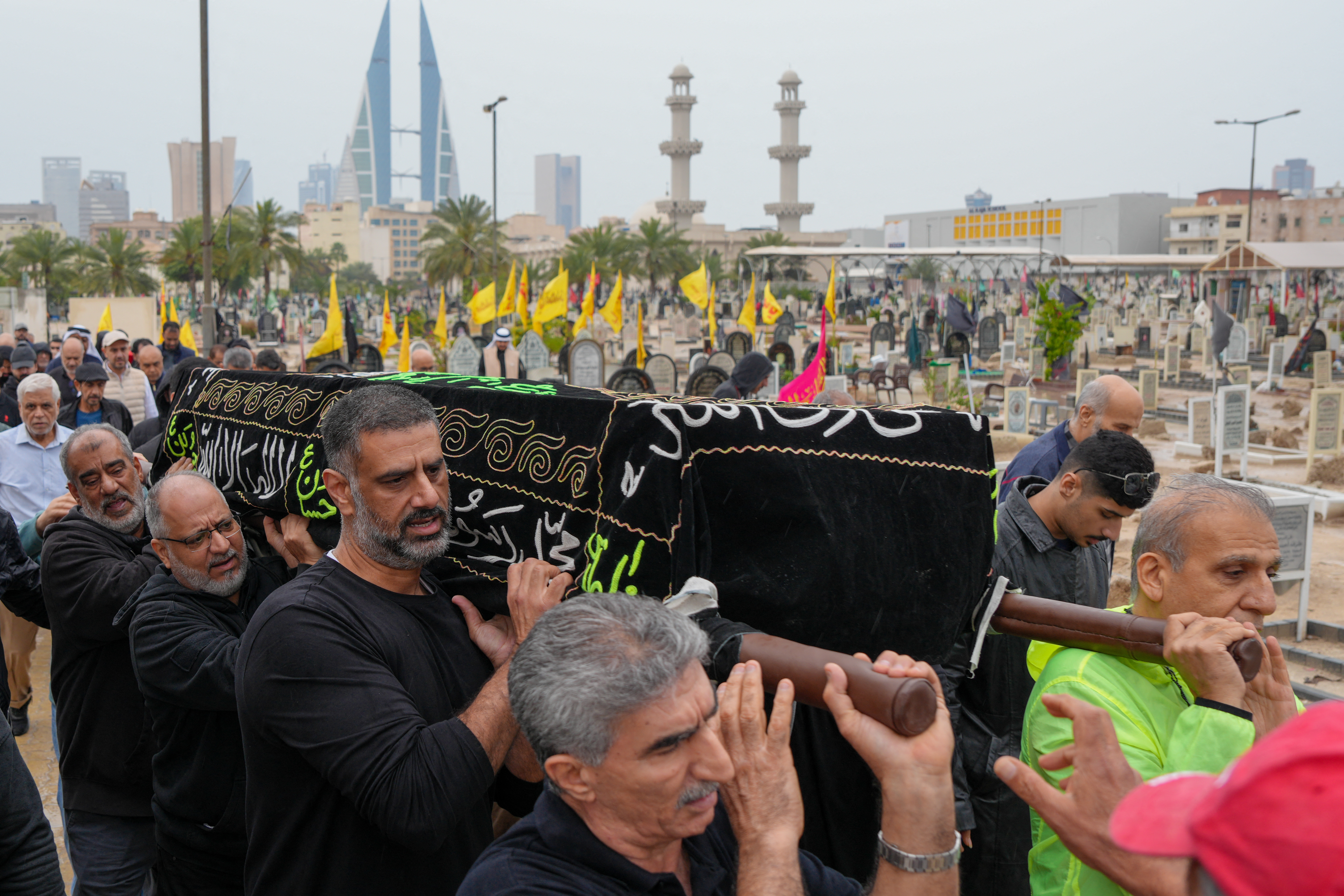 People carry the coffin of a victim.