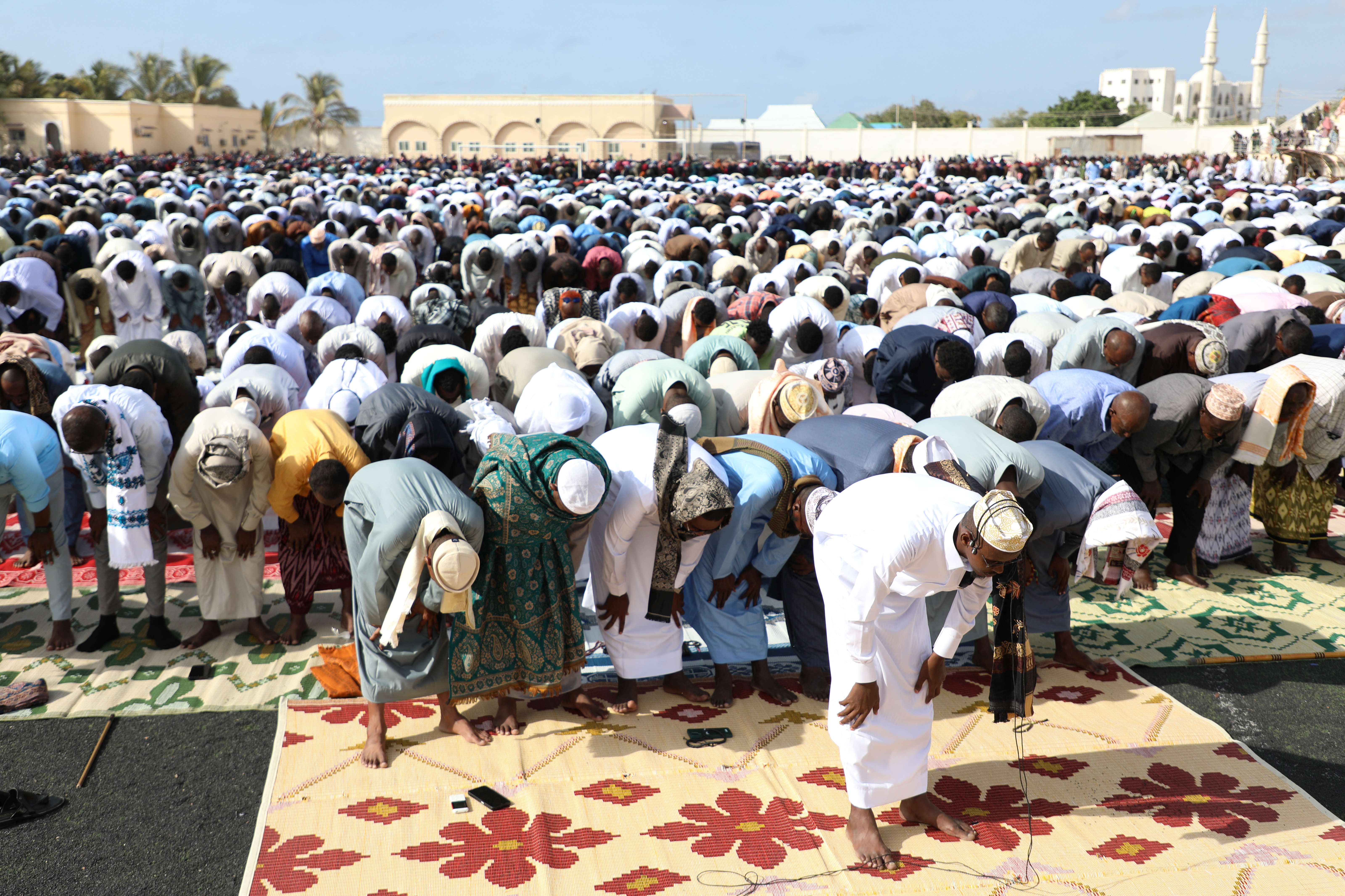 Muslim devotees offer Eid al-Fitr prayers, marking the end of the holy month of Ramadan, in Mogadishu on March 20, 2026. (Photo by Hassan Ali ELMI / AFP)