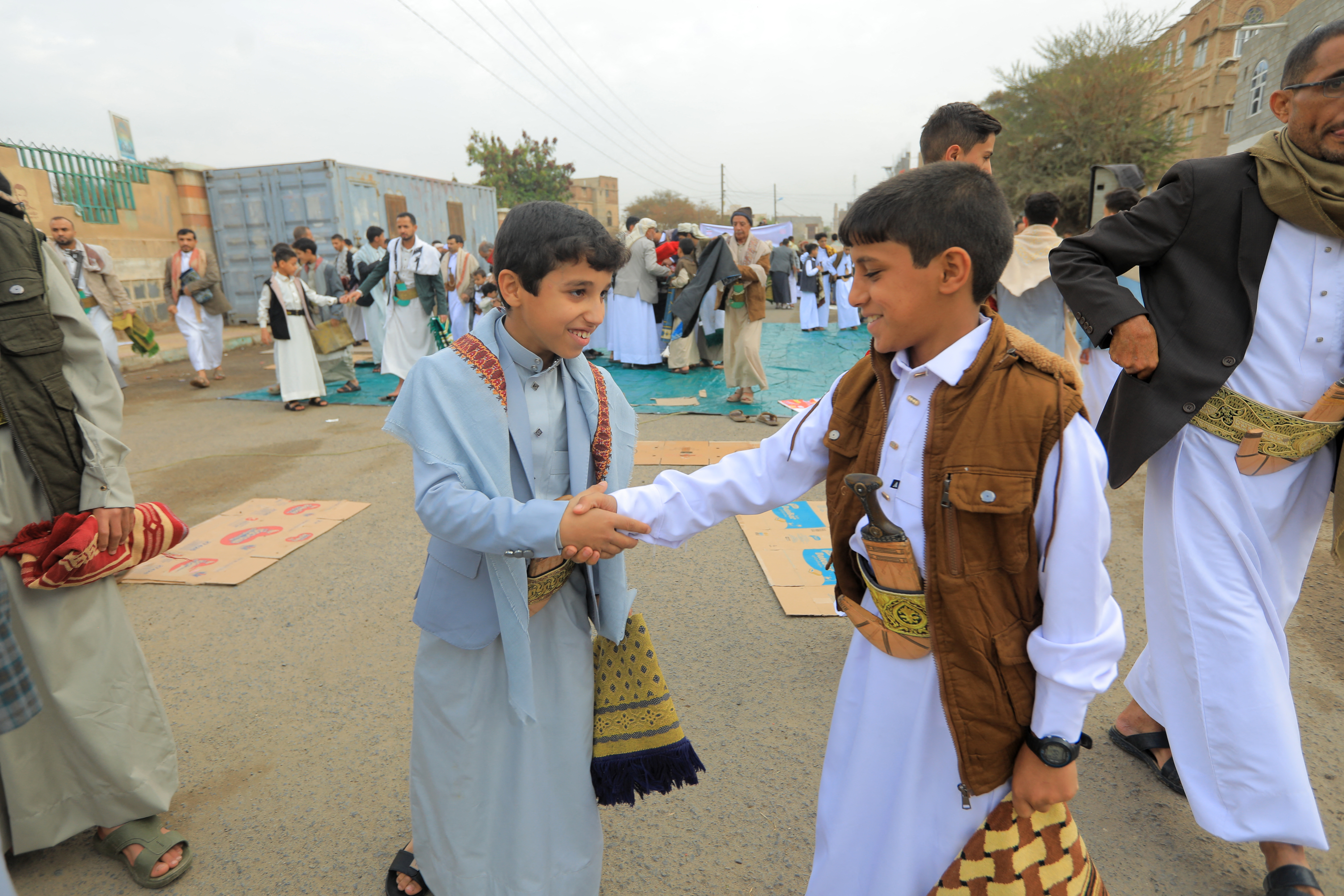 Yemenis exchange greetings after the morning Eid al-Fitr prayers, which marks the end of the holy fasting month of Ramadan, in the capital Sanaa on March 20, 2026. (Photo by Mohammed HUWAIS / AFP)