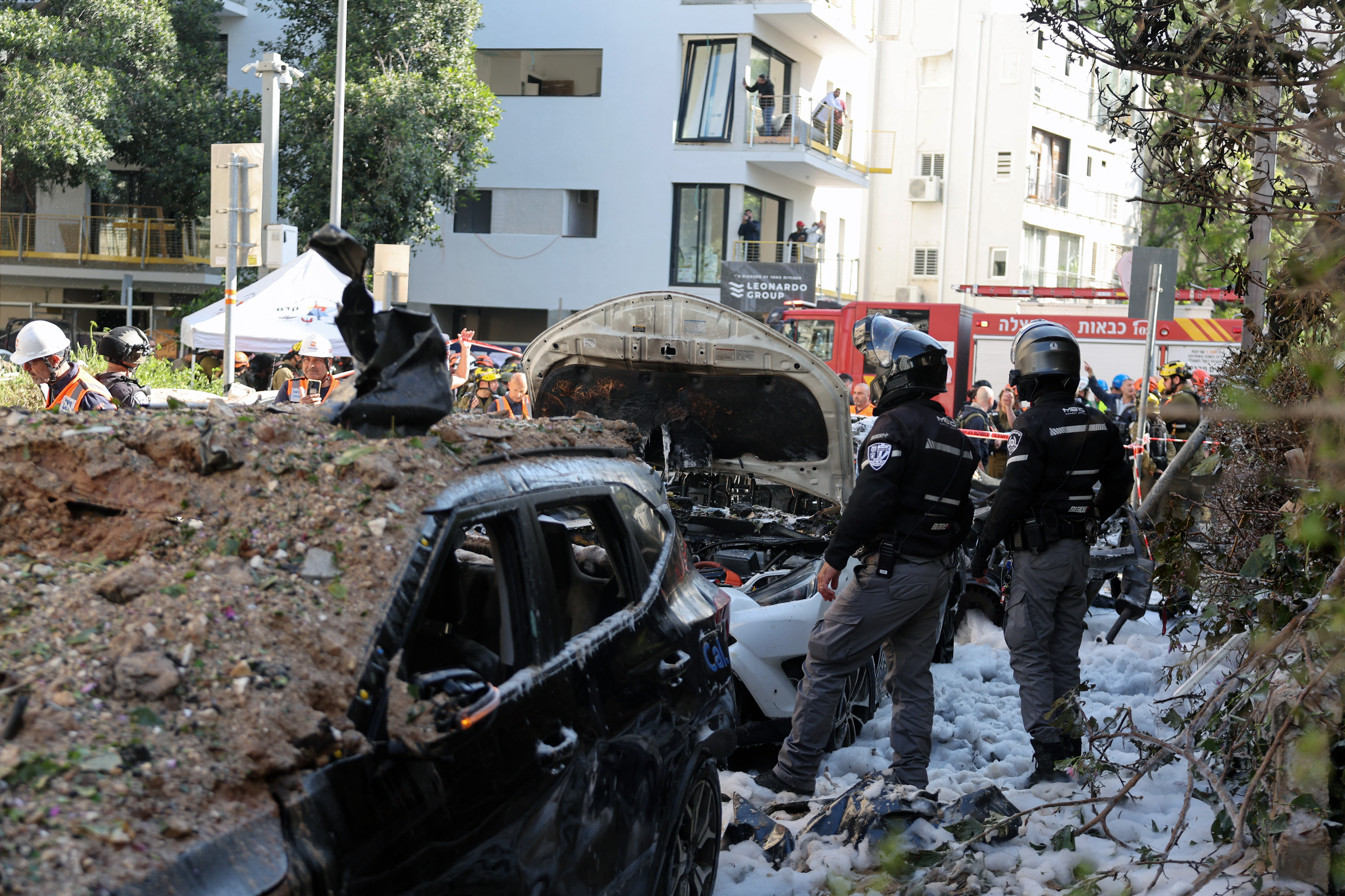 This picture shows damaged buildings at the site of an Iranian missile strike in Tel Aviv