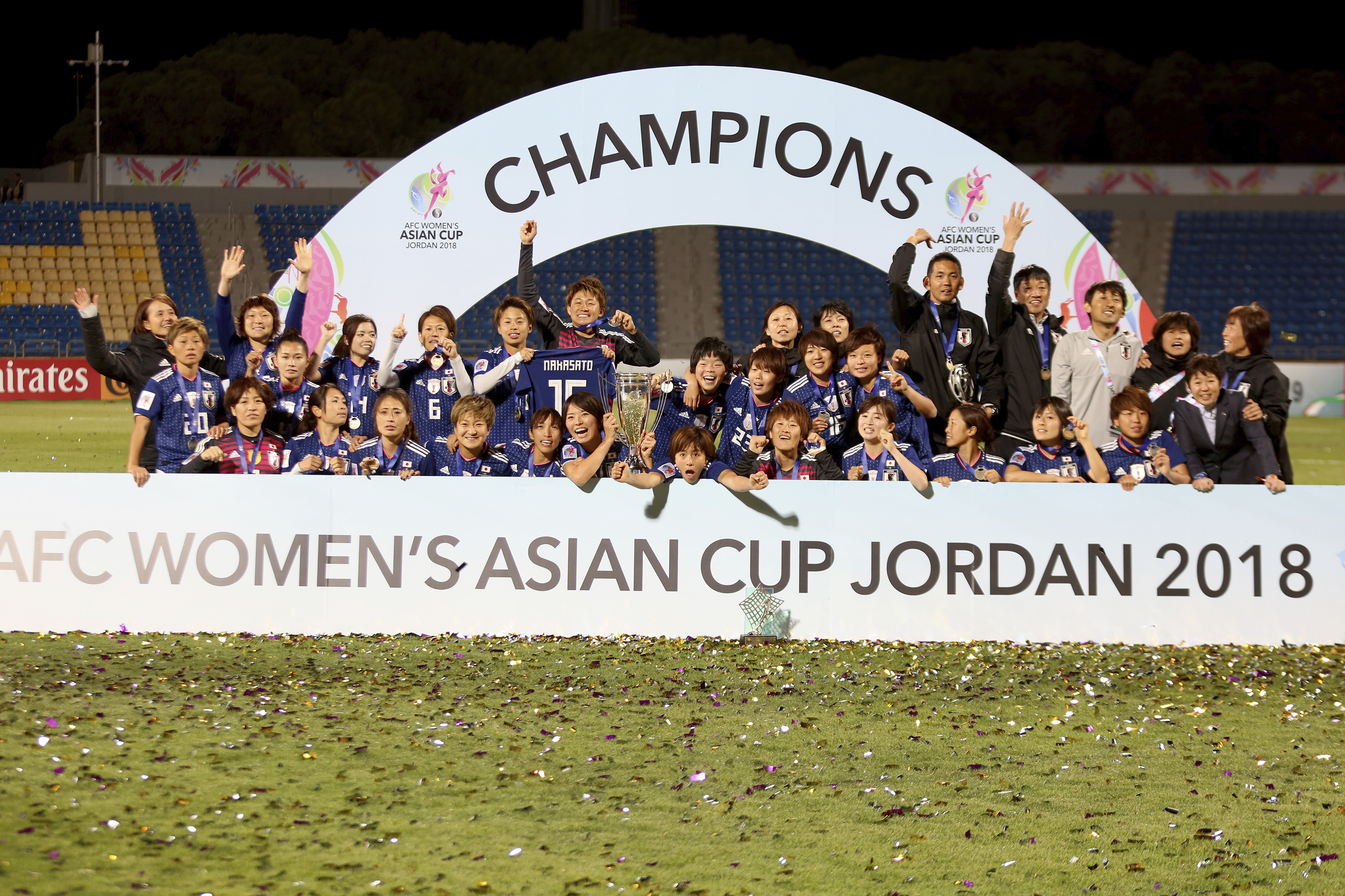 Japan players celebrate with the trophy after winning the AFC Women's Asian Cup Finals match against Australia at the King Abdullah II Stadium in the Jordanian capital. Japan defeated Australia 1-0 to win the cup in Amman, Jordan, Friday, April 20, 2018. (AP Photo/Raad Adayleh)