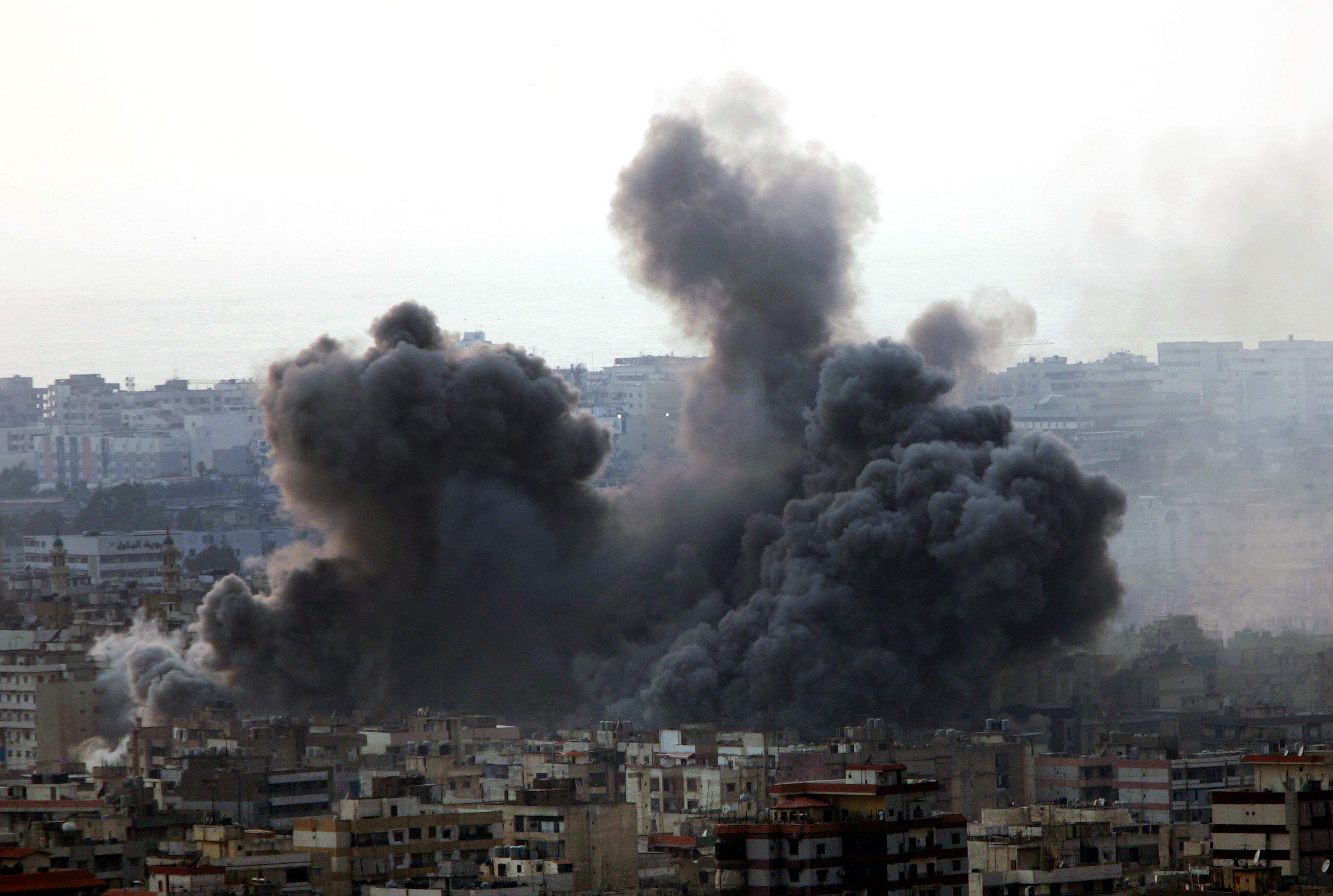 In this July 15, 2006 photo, an Israeli air strike hits the residential area which is a Hezbollah stronghold, in the southern suburbs of Beirut, Lebanon 
