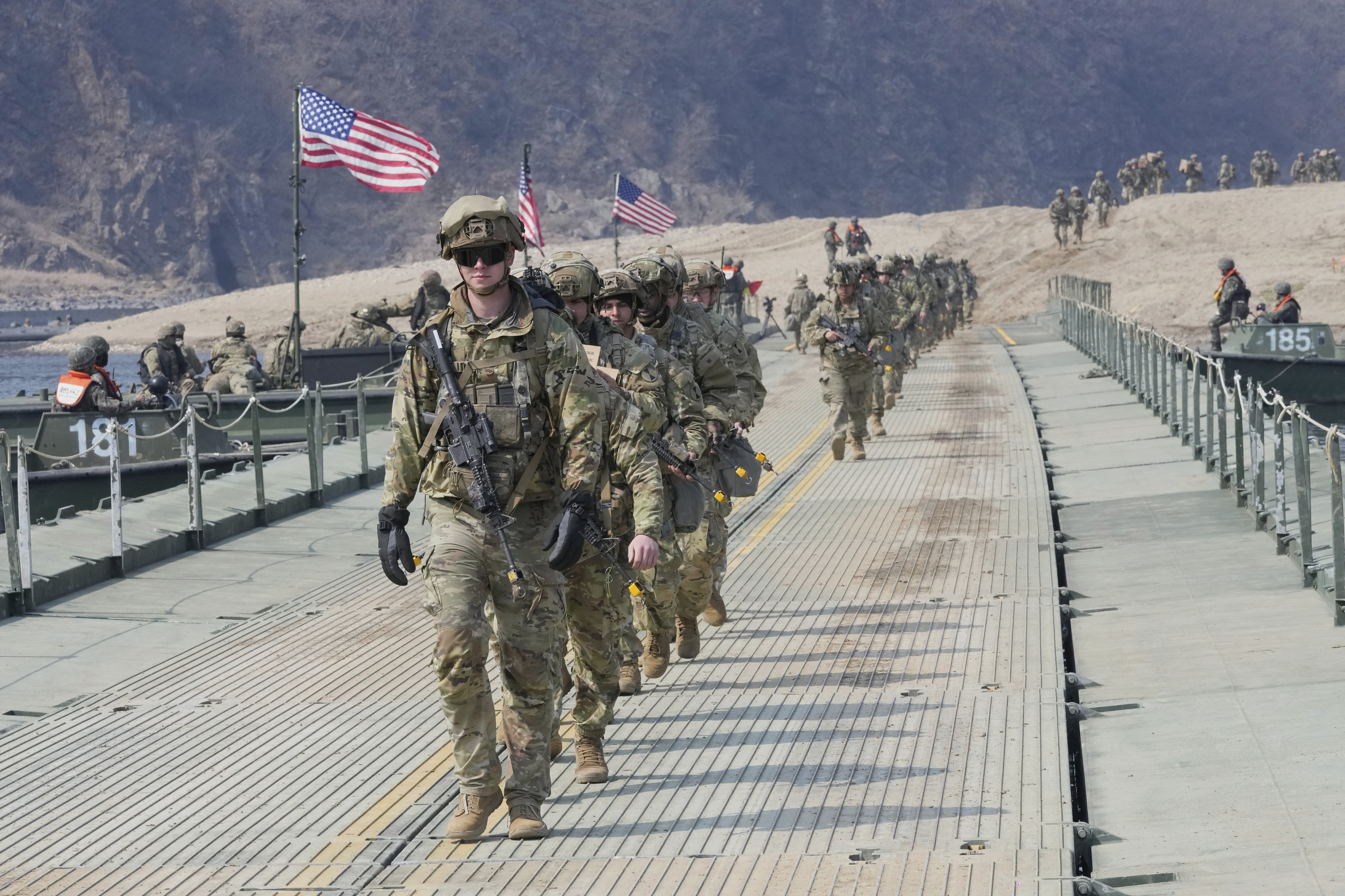 US soldiers cross a floating bridge during a joint river-crossing exercise in South Korea in Yeoncheon