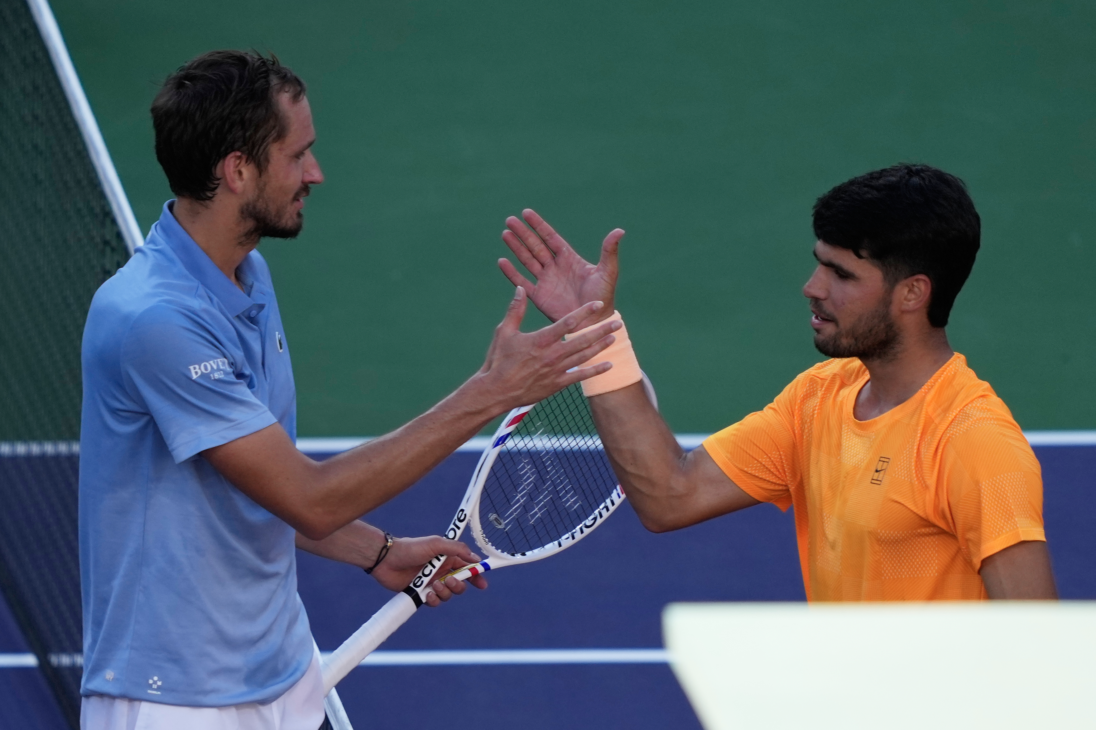 Daniil Medvedev, of Russia, left, is congratulated by Carlos Alcaraz, of Spain, after Medvedev defeated Alcaraz during a semifinal match at the BNP Paribas Open tennis tournament, Saturday, March 14, 2026, in Indian Wells, Calif. (AP Photo/Mark J. Terrill)