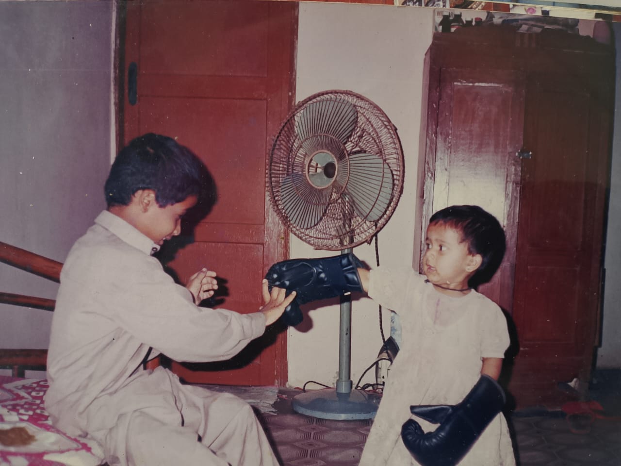 An undated childhood photo of son, Munir (L) and daughter Anam [Courtesy of Younus Qambrani]