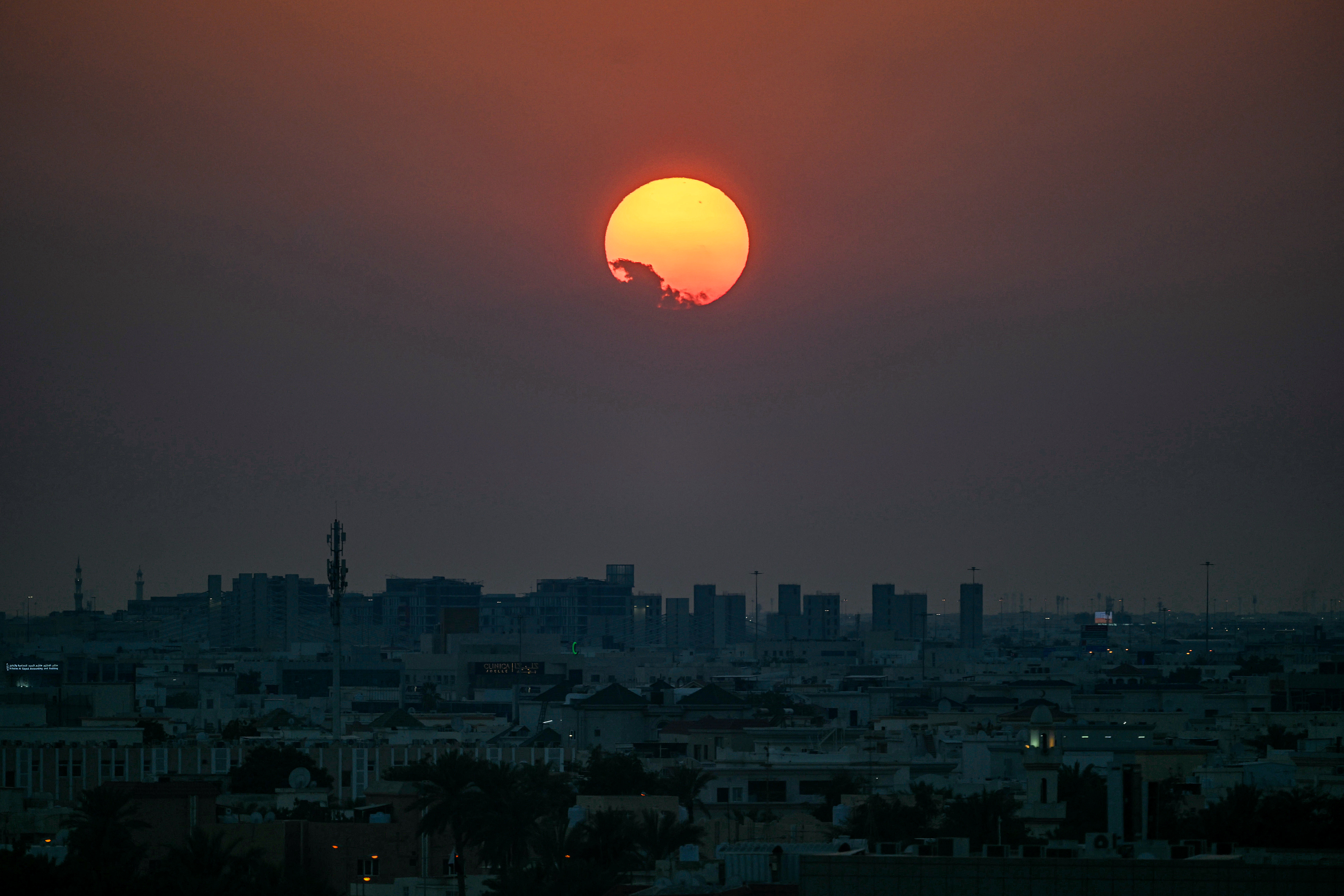 The sun sets over Qatar's capital Doha on February 28, 2026.