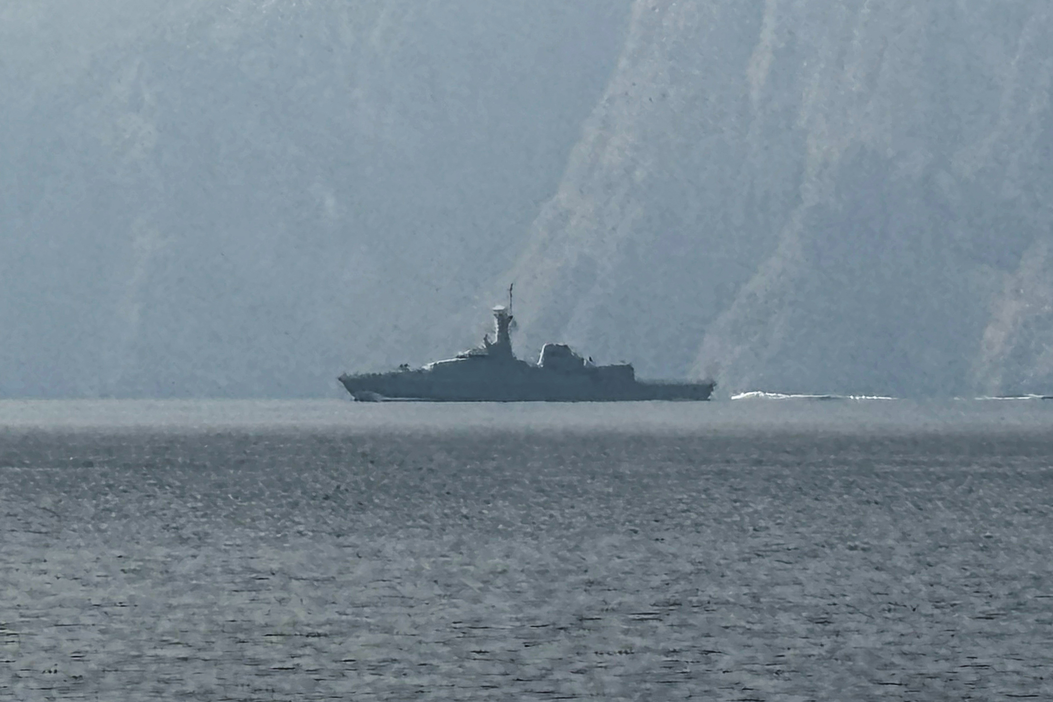 A navy vessel is seen sailing in the Strait of Hormuz.