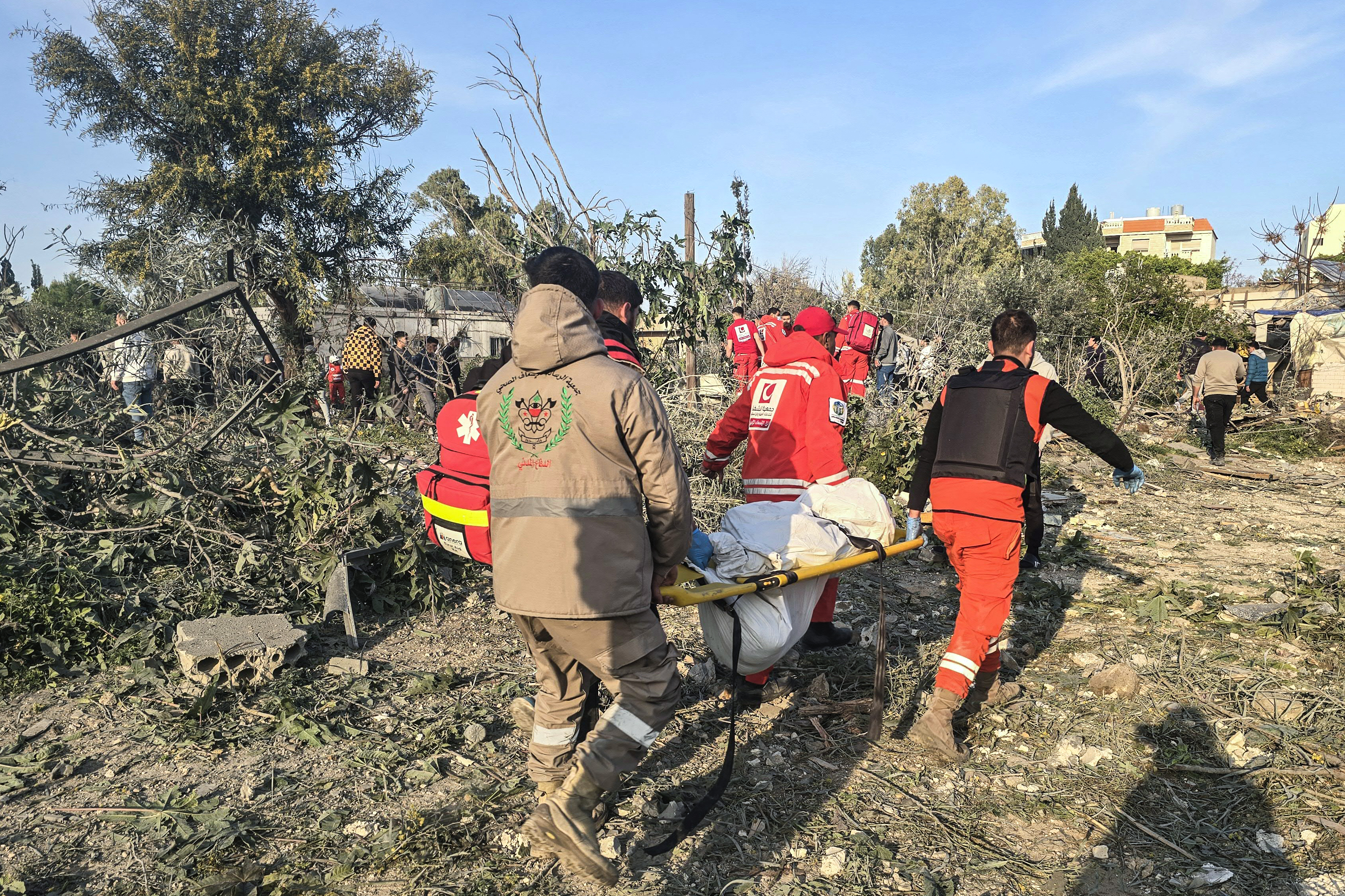 First aid responders evacuate a body from the site of an Israeli airstrike that targeted the southern Lebanese city of Tyre on March 6, 2026.