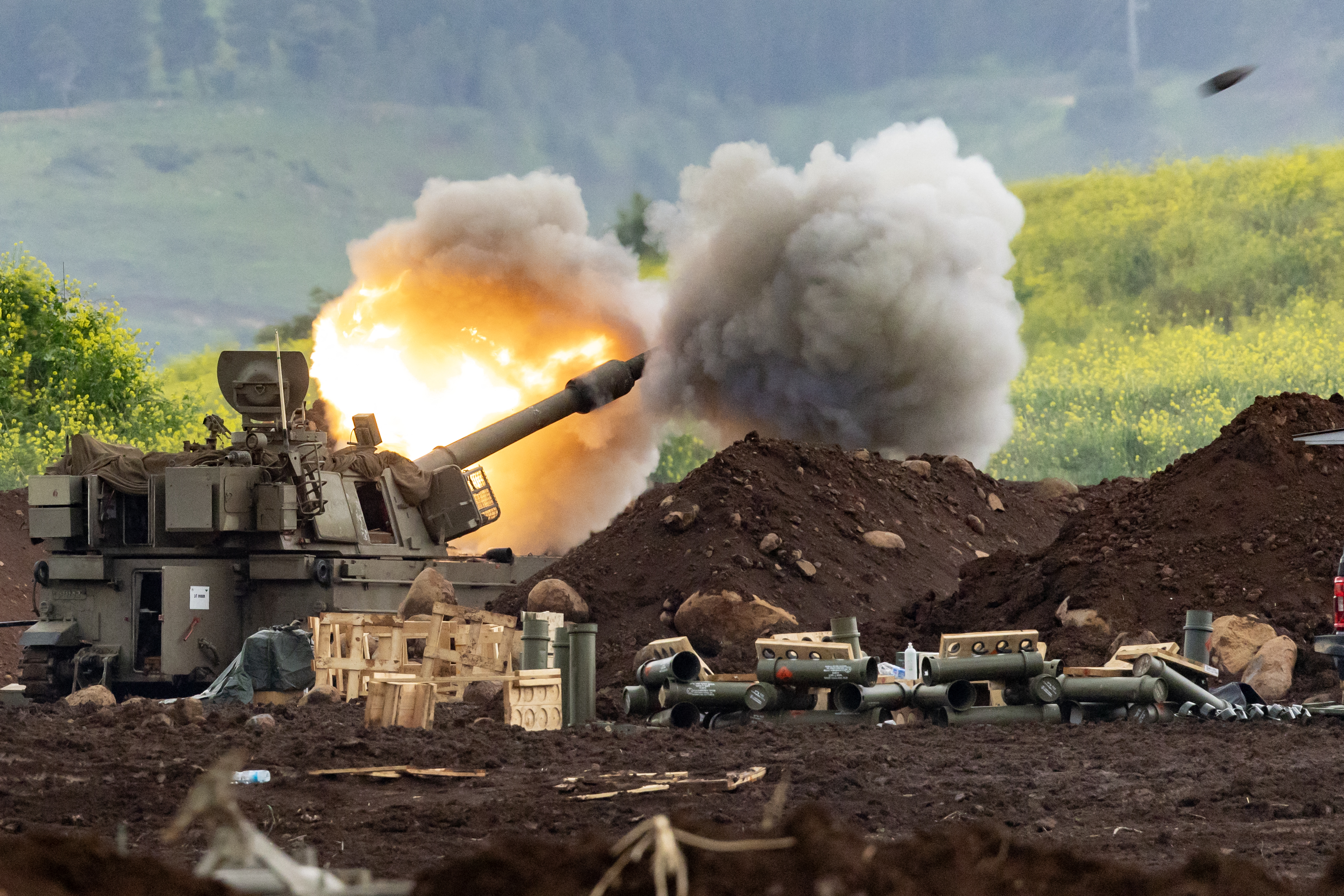 An Israeli self-propelled howitzer artillery gun fires towards southern Lebanon from a position in the Upper Galilee in northern Israel near the border