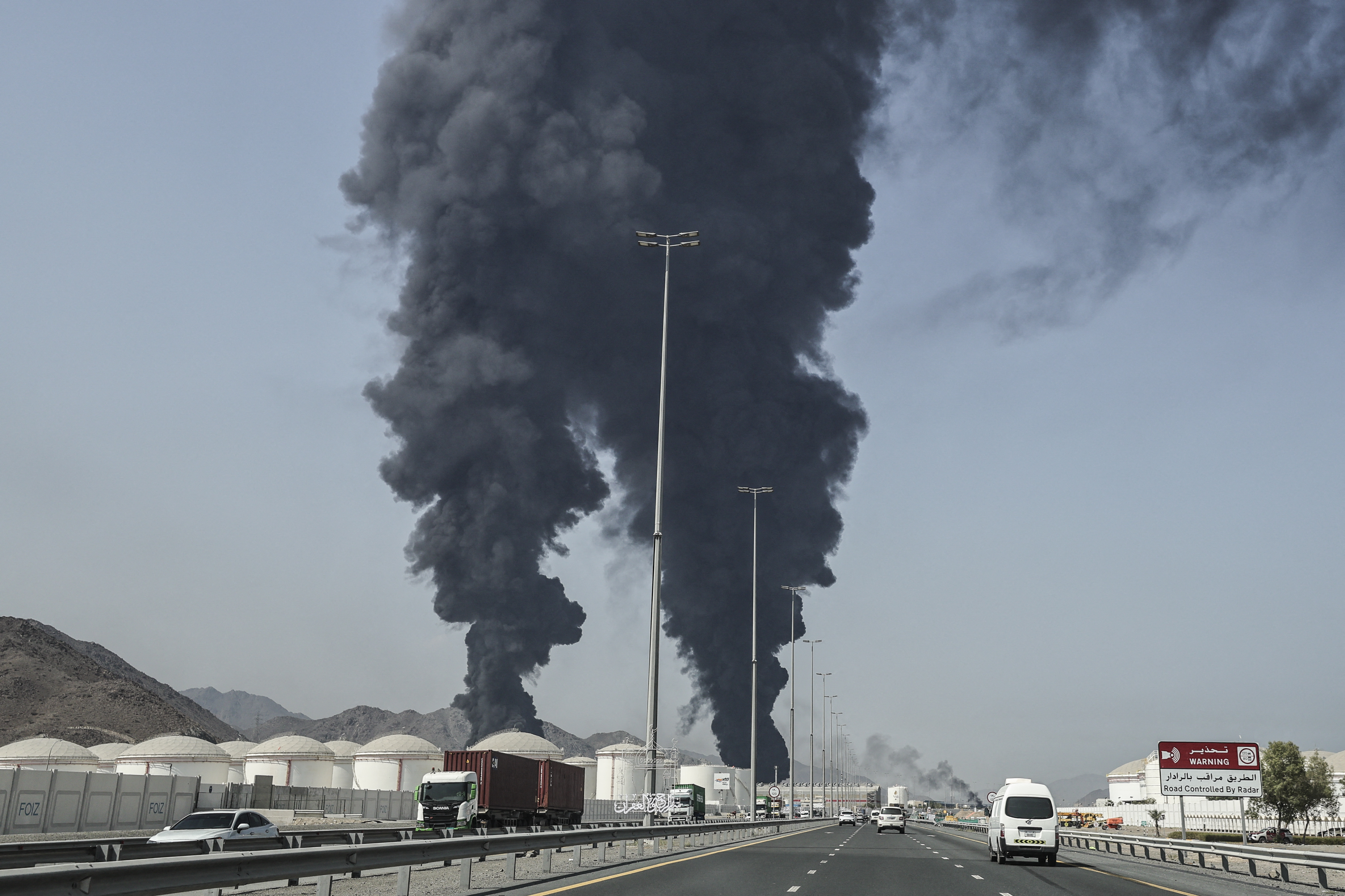 Smoke rises from the direction of an energy installation in the Gulf emirate of Fujairah on March 14, 2026.