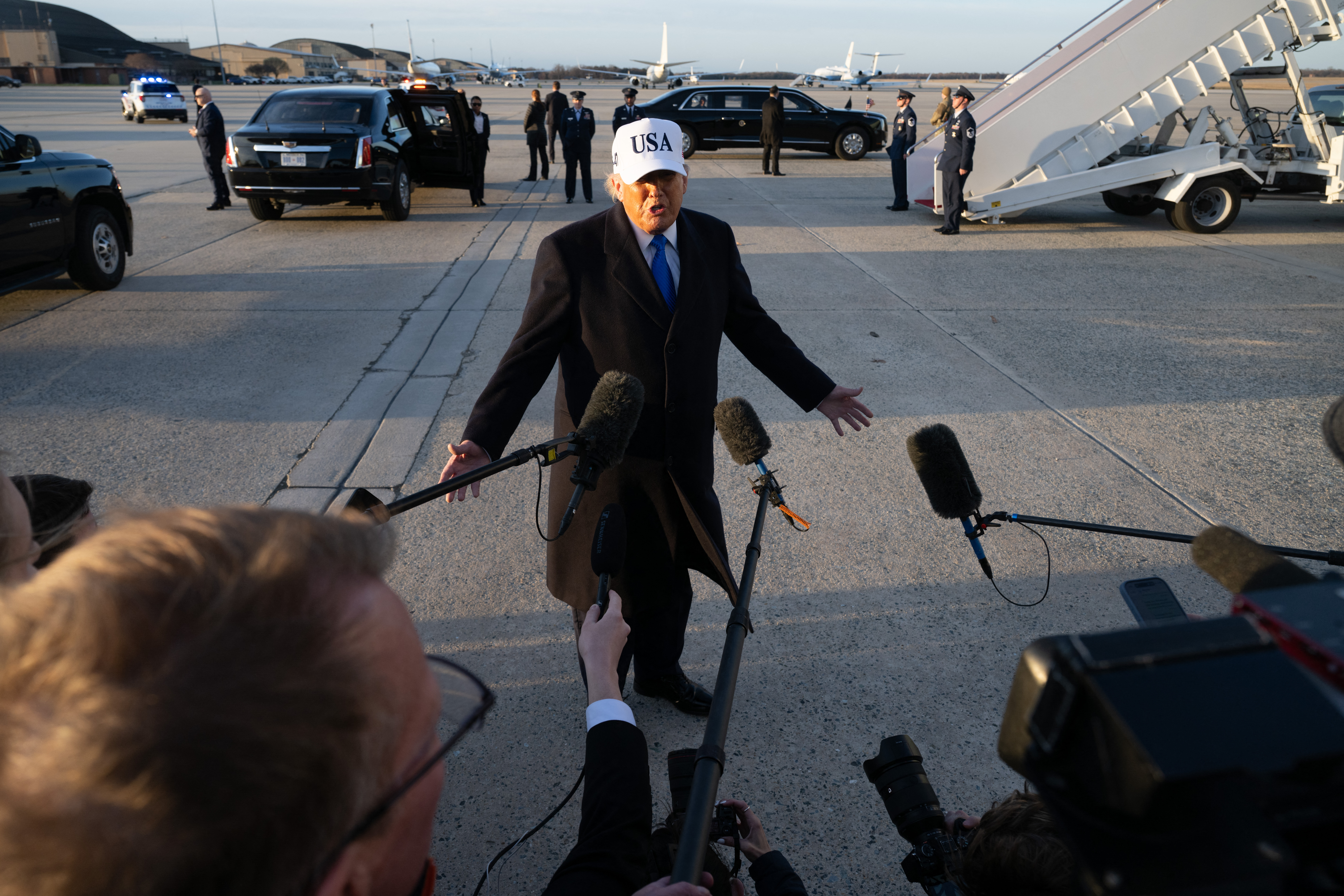 US President Donald Trump speaks to reporters before boarding Air Force One as he departs Joint Base Andrews in Maryland on March 13, 2026.