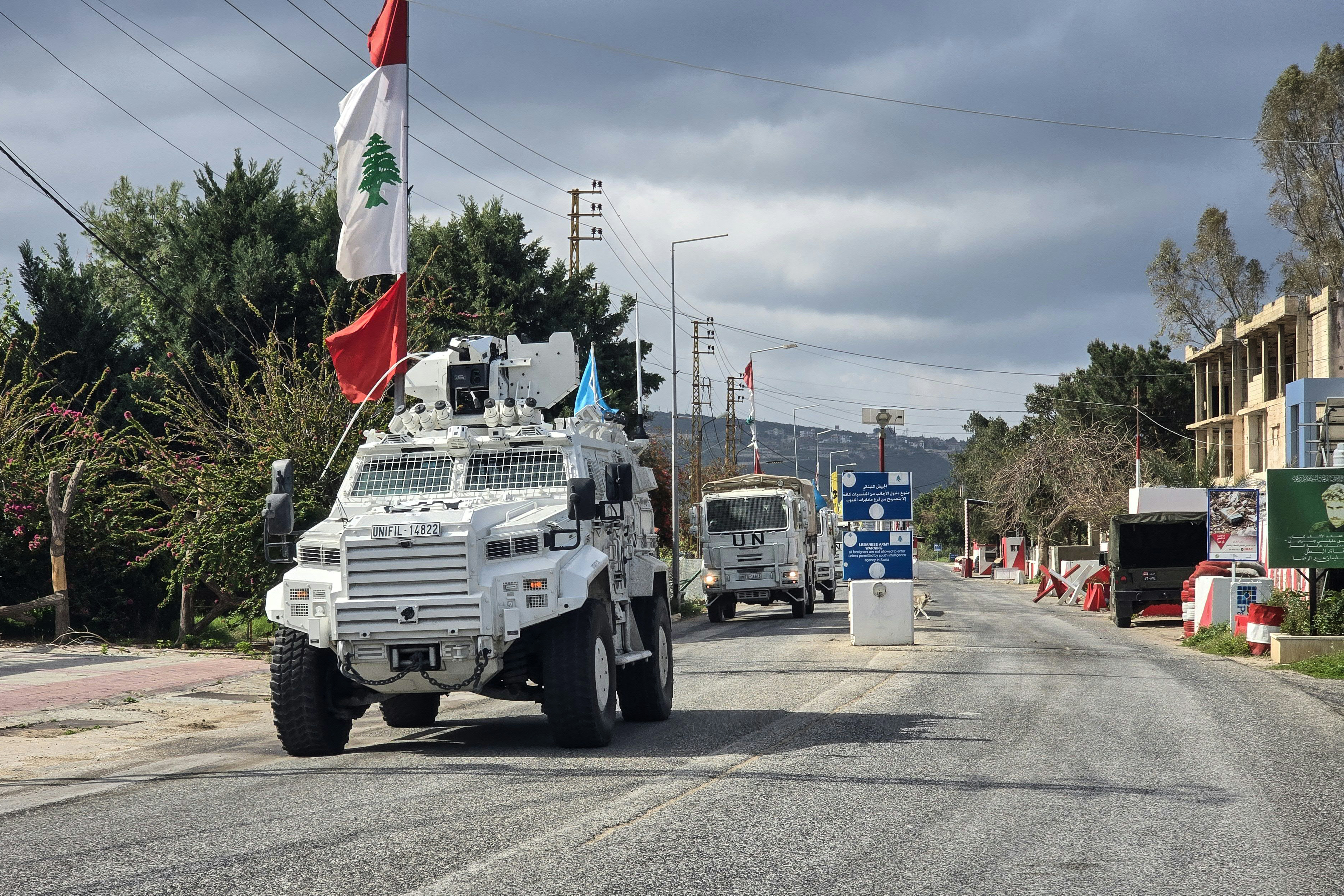United Nations peacekeepers with the UN Interim Force in Lebanon (UNIFIL) drive past a Lebanese army outpost in the area of Naqura in southern Lebanon on March 27, 2026.