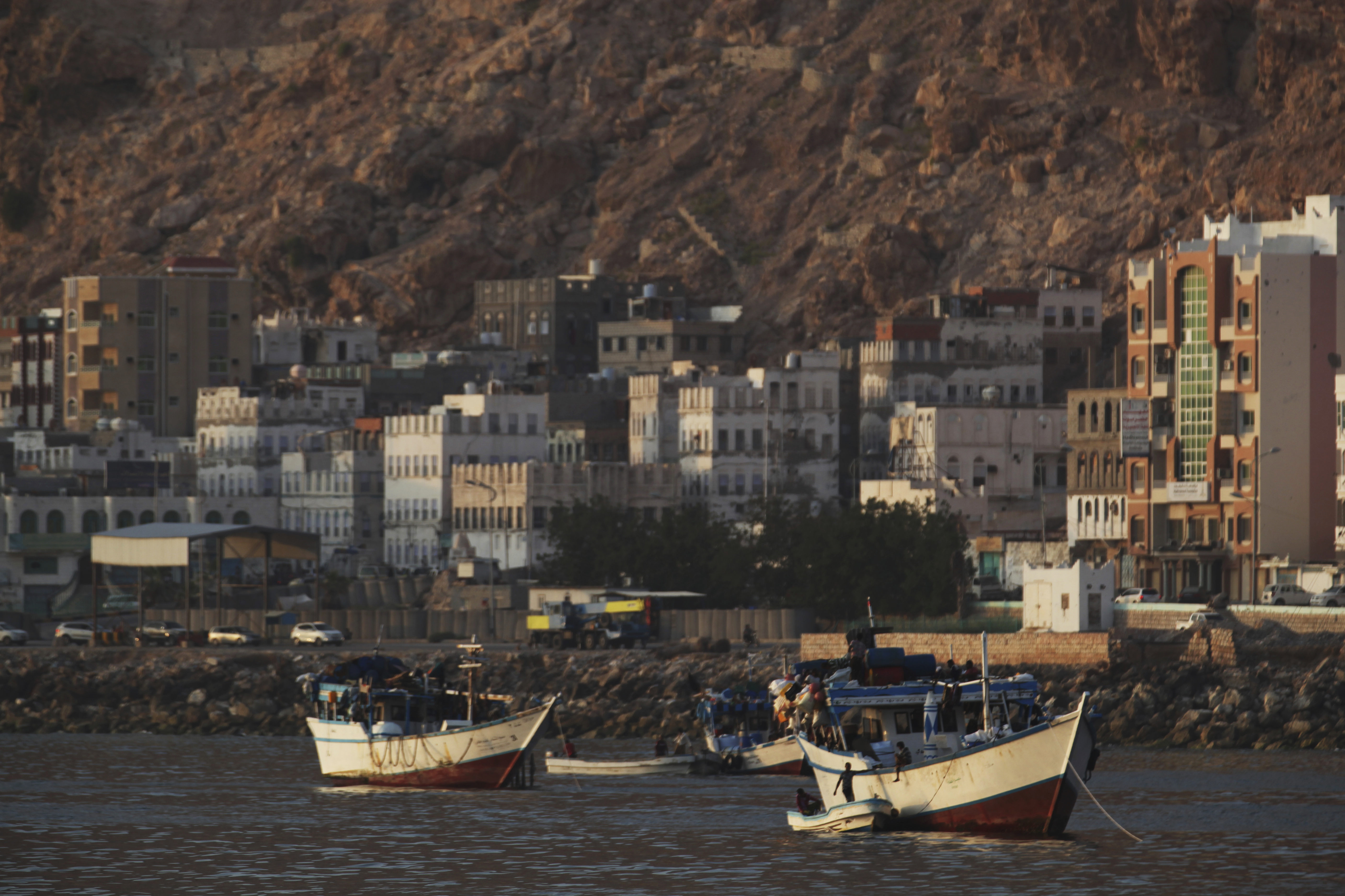 In this Thursday, Nov. 29, 2018 photograph, boats are anchored near Mukalla, Yemen. The port city of Mukalla, once held by al-Qaida, shows how fractious Yemen is and will remain even if the Saudi-led war in the country ends in an uneasy peace for the Arab world's poorest nation. (AP Photo/Jon Gambrell)