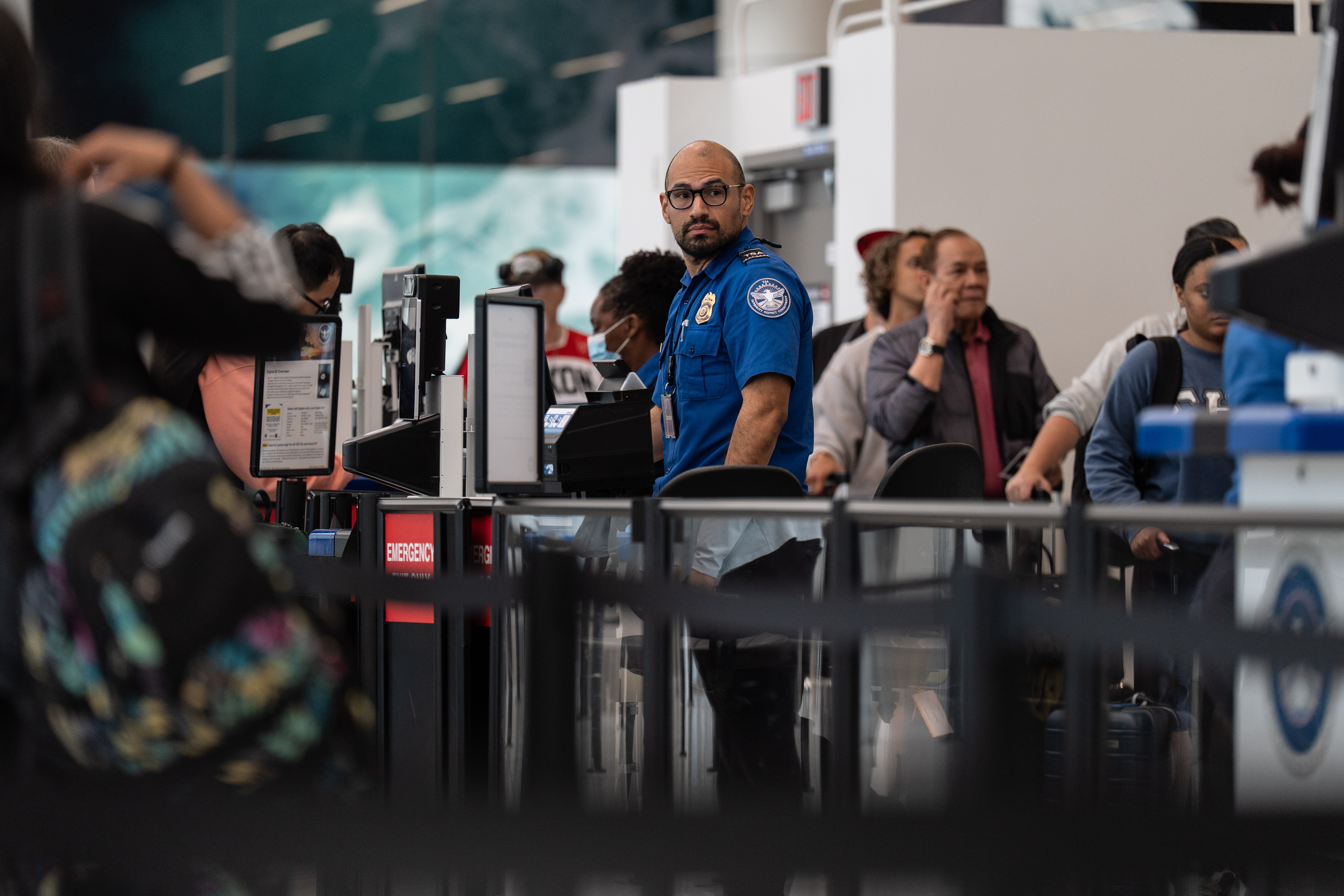 A TSA agent works at Los Angeles International Airport in Los Angeles, Friday, March 27, 2026. (AP Photo/Jae C. Hong)
