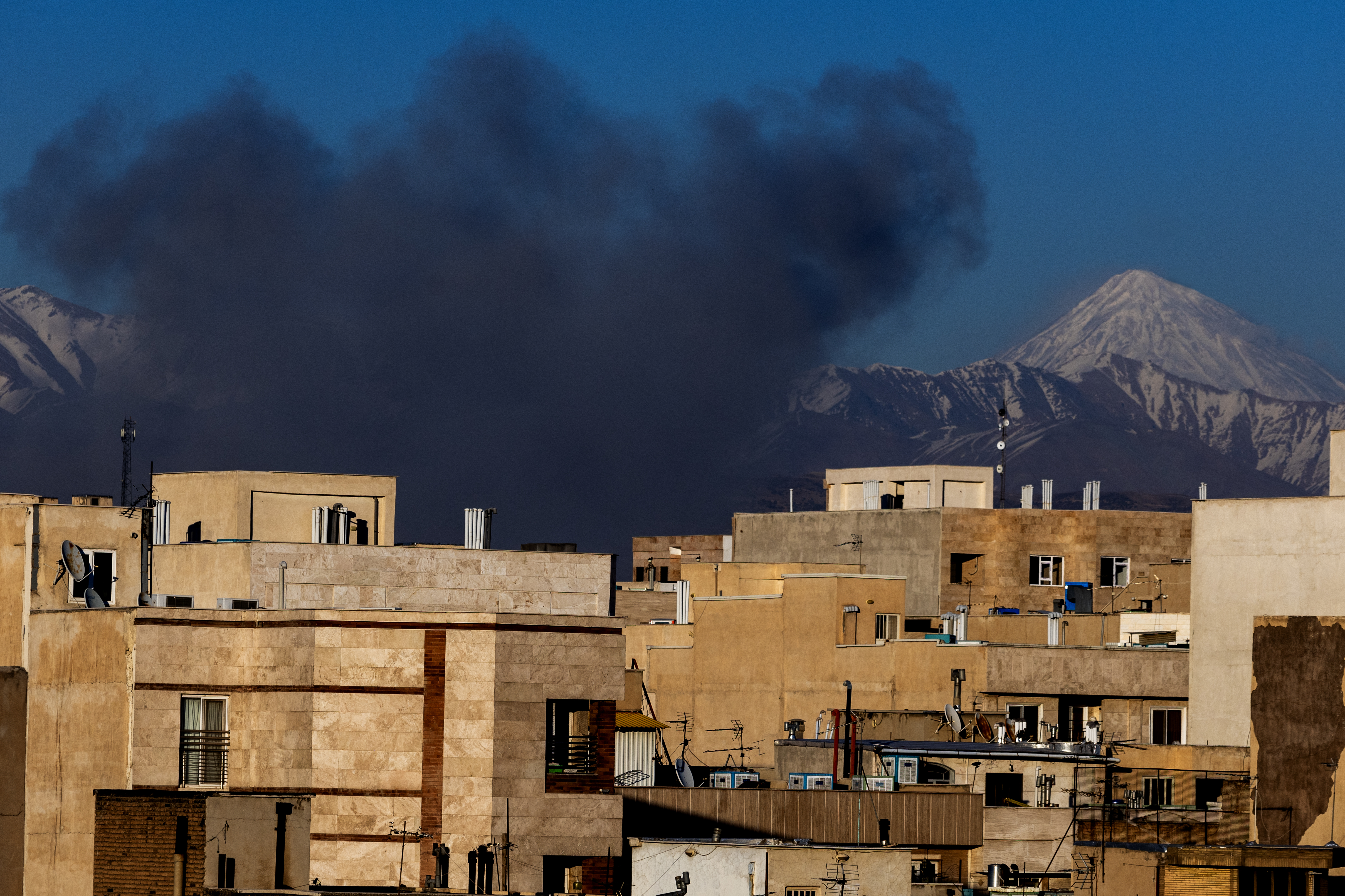 TEHRAN, IRAN - MARCH 3: Smoke rises over buildings on March 3, 2026 in Tehran, Iran. Iran's Supreme Leader, Ayatollah Ali Khamenei, was confirmed killed after the United States and Israel launched a joint attack on Iran on February 28. Iran retaliated by firing waves of missiles and drones at Israel, and targeting U.S. allies in the region. (Photo by Majid Saeedi/Getty Images)