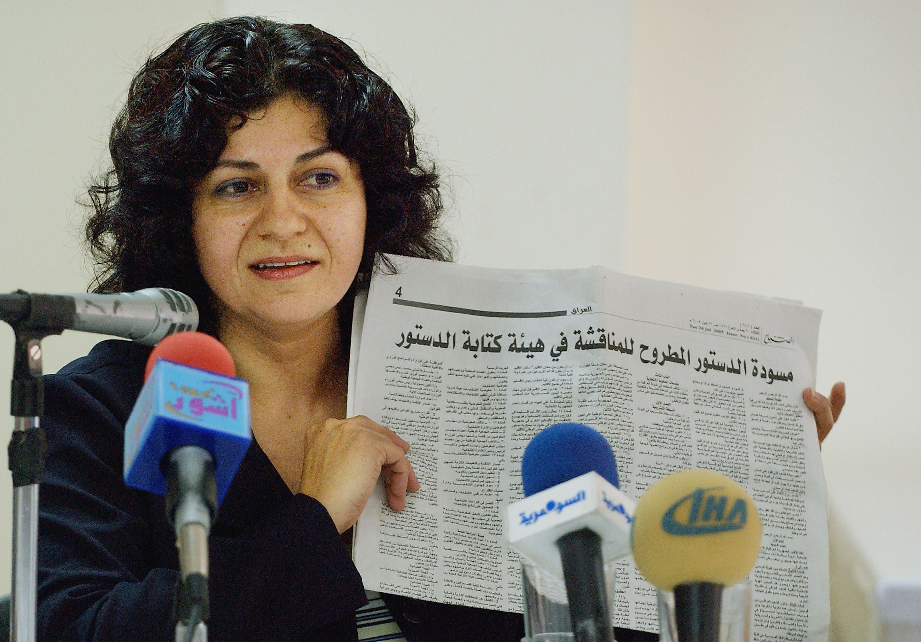 BAGHDAD, IRAQ - JULY 28: Yanar Mohammed, head of the Women's Freedom in Iraq movement, speaks to reporters as she holds a draft of Iraq's new constitution printed in a local newspaper July 28, 2005 in Baghdad, Iraq. Mrs. Mohammed opposes the idea of regarding Islam as the major source for law in Iraq's new constitution and expressed her concerns about Iraq turning into another Afghanistan under a Taliban style rule. (Photo by Wathiq Khuzaie/Getty Images)