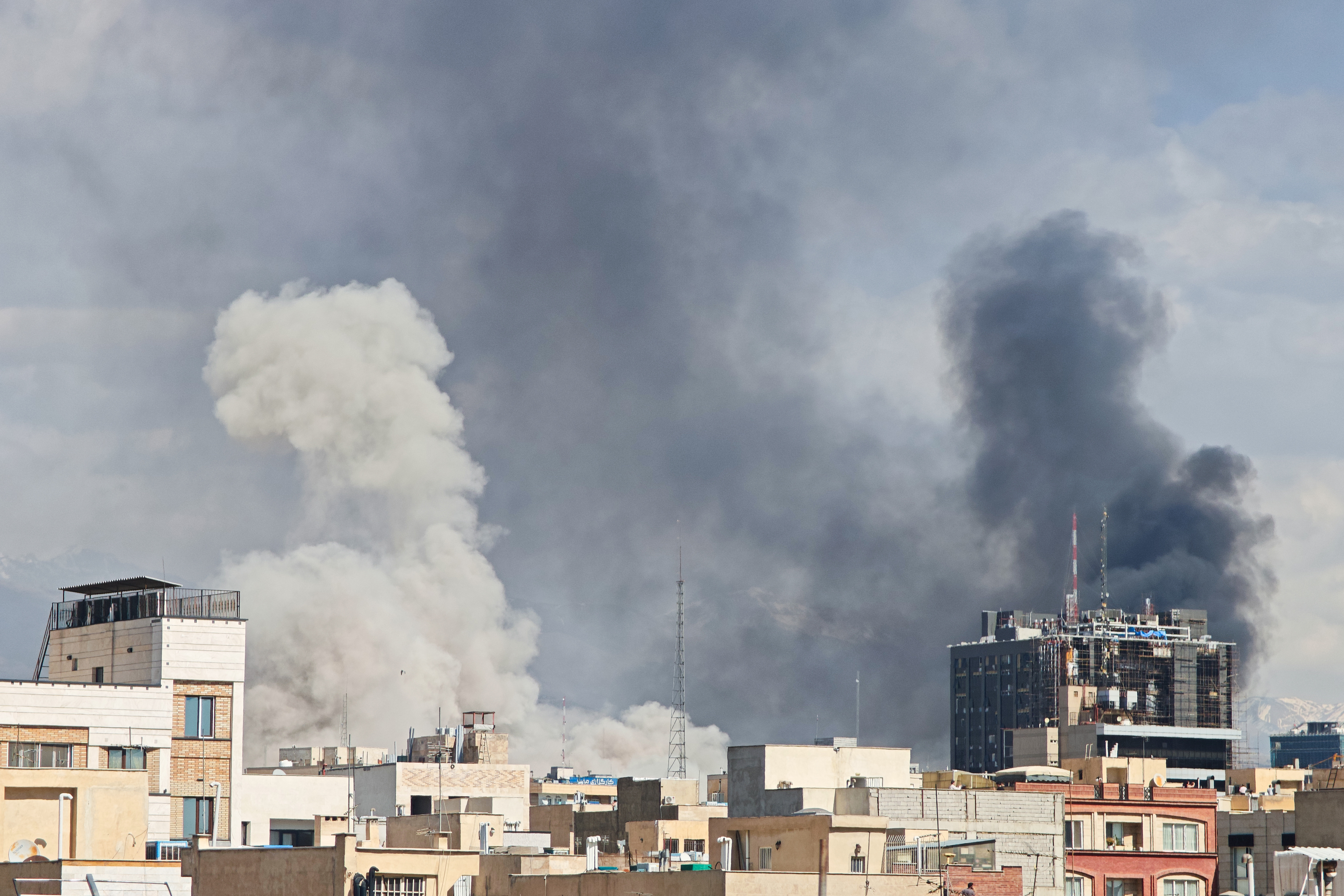 TEHRAN, IRAN - MARCH 1: Plumes of smoke rise over the skyline following explosions on March 1, 2026 in Tehran, Iran. Iran's Supreme Leader, Ayatollah Ali Khamenei, was confirmed killed after the United States and Israel launched a joint attack on Iran on February 28. Iran retaliated by firing waves of missiles and drones at Israel, and targeting U.S. allies in the region. (Photo by Majid Saeedi/Getty Images)