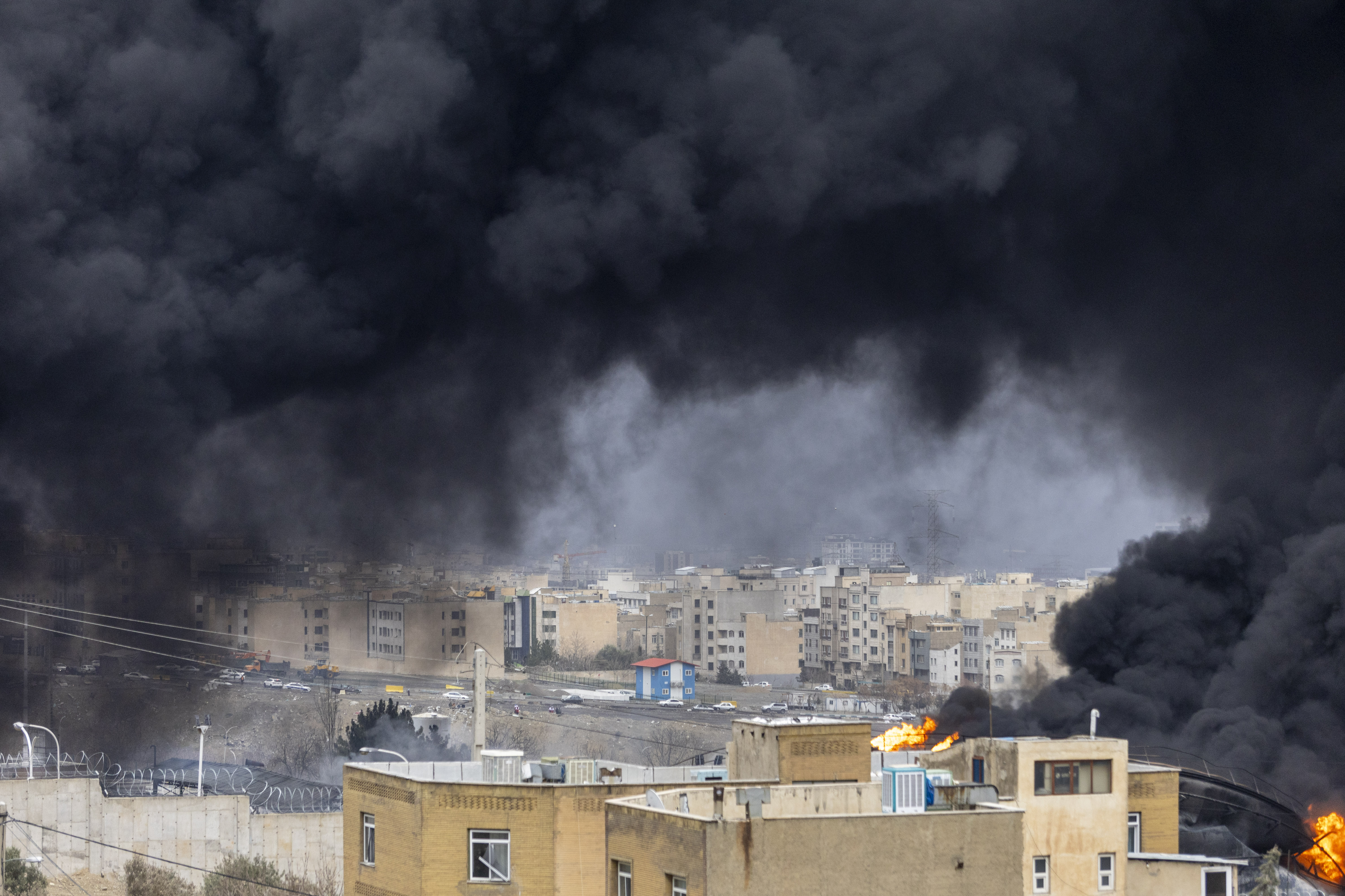 TEHRAN, IRAN - MARCH 8: Smoke billows after overnight airstrikes on oil depots on March 8, 2026 in Tehran, Iran. The United States and Israel continued their joint attack on Iran that began on February 28. Iran retaliated by firing waves of missiles and drones at Israel, and targeting U.S. allies in the region. (Photo by Majid Saeedi/Getty Images)