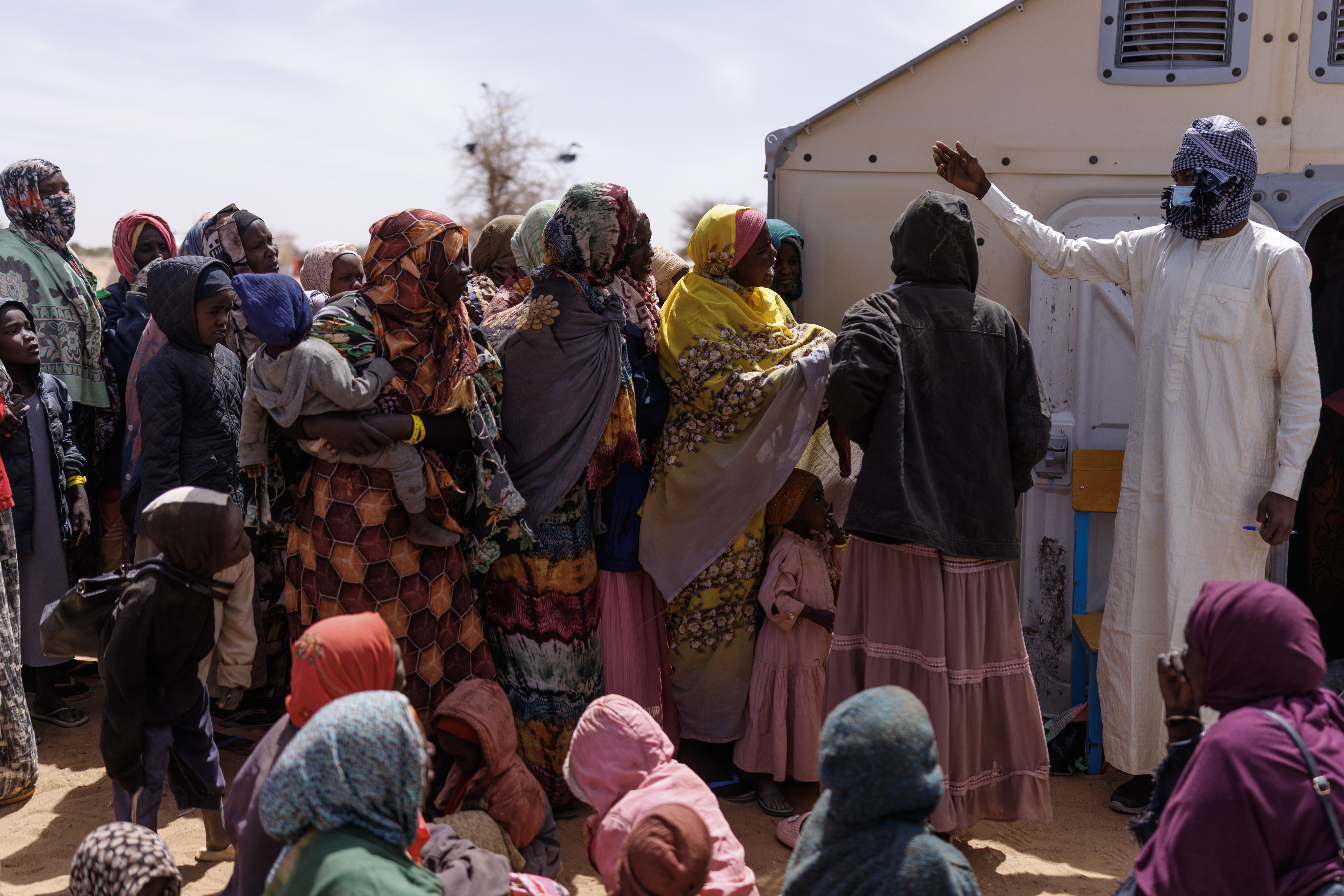 OURE CASSONI, CHAD - FEBRUARY 24: Newly arrived Sudanese refugees wait to be registered in order to collect food aid at the Oure Cassoni refugee camp on February 24, 2026 in Oure Cassoni, Chad. In April 2023 civil war erupted between the Sudanese Armed Forces (SAF) and the armed militia group Rapid Support Forces (RSF). The ongoing conflict has so far displaced around 14 million people across the region, triggering a widespread humanitarian crisis, as neighboring countries like Chad struggle to absorb refugees, while coping with populations already suffering high poverty rates and food insecurity. Chad has become Africa's largest host of refugees per capita, hosting a total 1.4 million refugees - more than 900,000 of which fled the conflict in Sudan. The most recent wave of arrivals from Sudan follows the RSF's offensive to capture the north Darfur city of El Fasher, where 6,000 people were reportedly killed by the RSF in the space of three days in October. A recent UN report has accused the RSF of atrocities that amount to war crimes and possible crimes against humanity. As many as 400,000 people have reportedly been killed since the conflict began. (Photo by Dan Kitwood/Getty Images)