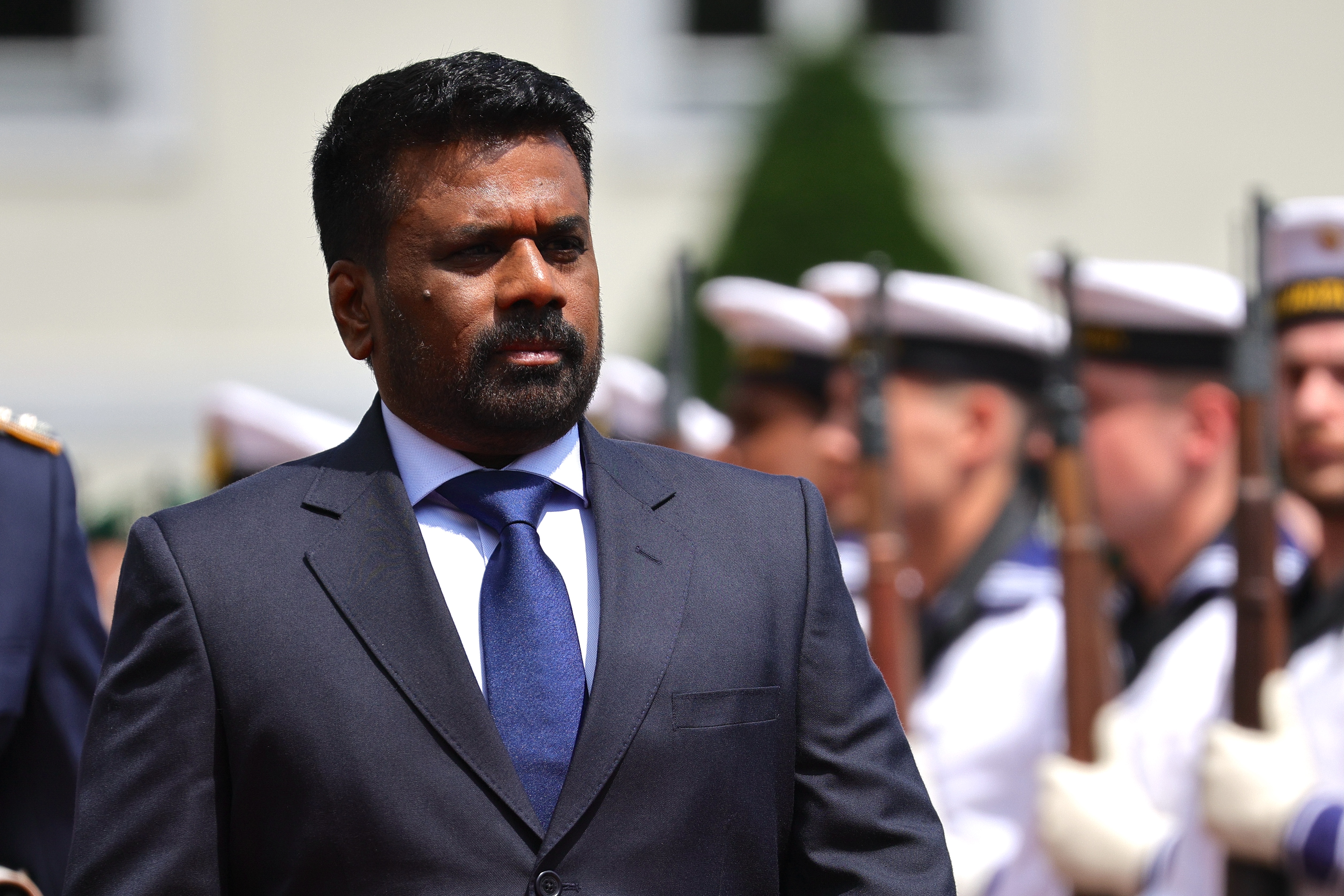 BERLIN, GERMANY - JUNE 11: Sri Lankan President Anura Kumara Dissanayake reviews an honor guard after being welcomed by German President Frank-Walter Steinmeier (not pictured)at Schloss Bellevue on June 11, 2025 in Berlin, Germany. This is Dissanayake's first official visit to Germany. (Photo by Omer Messinger/Getty Images)