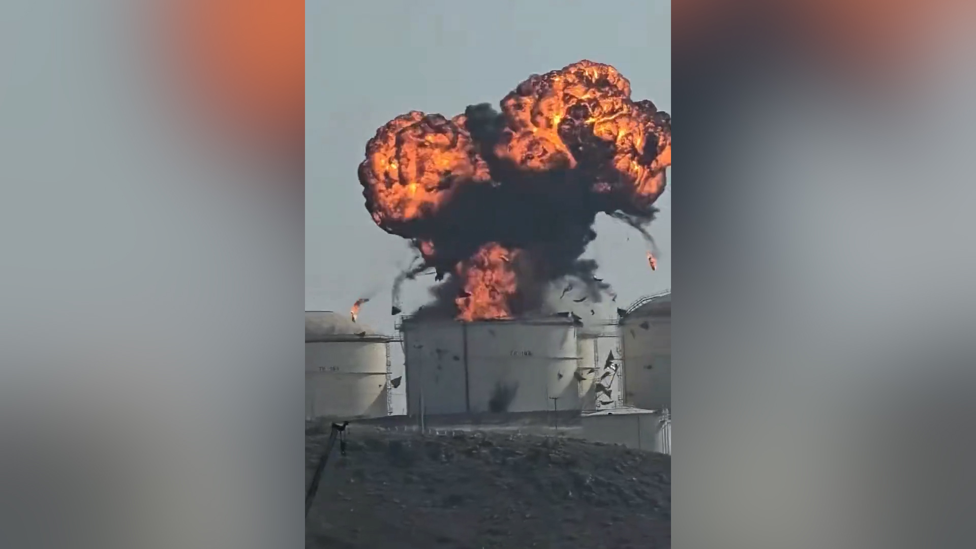 A screenshot from a video crew on-board a nearby vessel at Oman&rsquo;s Salalah port filmed the moment a drone struck the oil facility on March 11, 2026 [@Fahadnaimb/X]