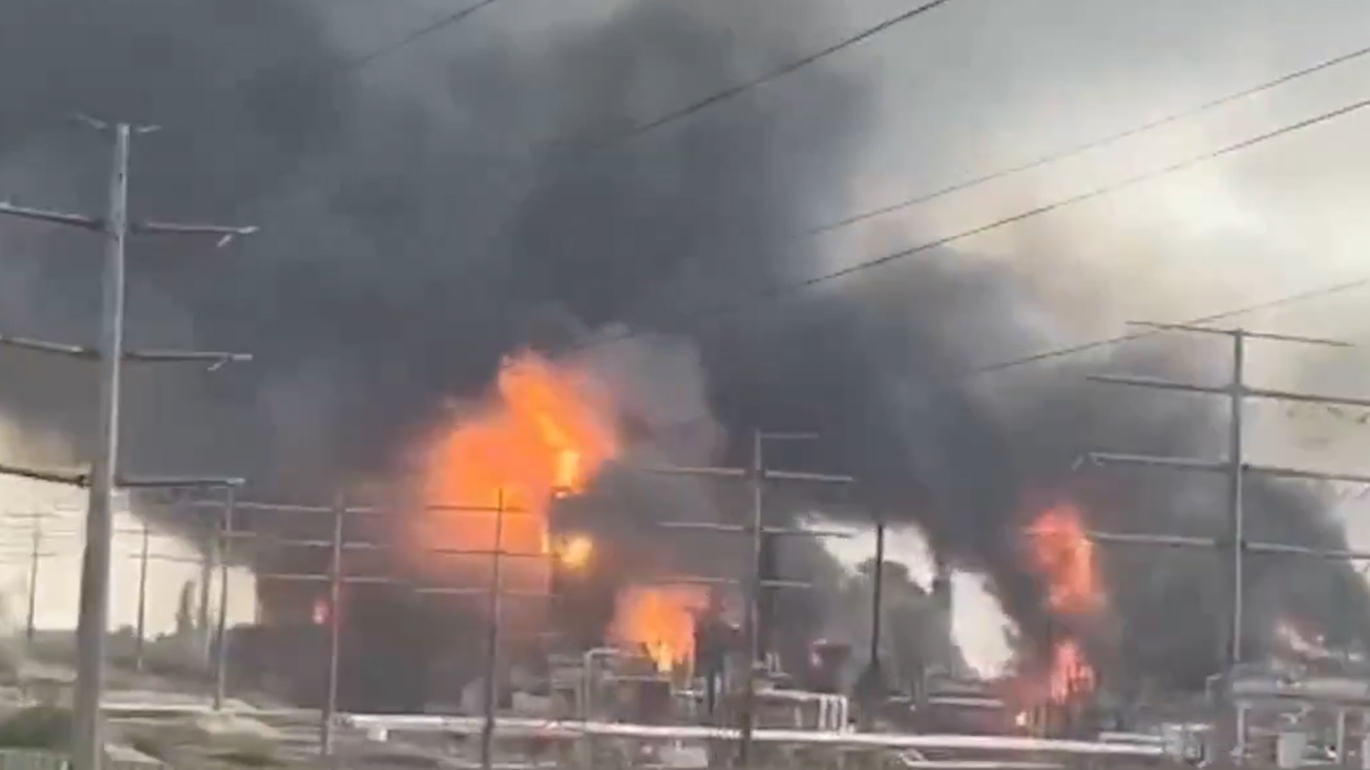 A screen shot shows an energy processing facility ablaze in Asaluyeh, Iran on March 18, 2026 following an Israeli strike. [TheLukeReport/X]