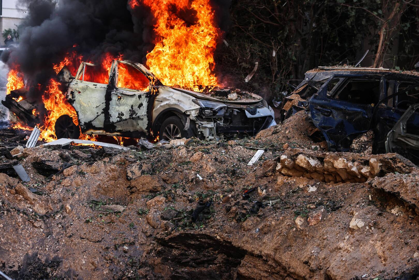 Fire engulfs a car at a site following Iranian missile barrages in central Israel, amid the US-Israel conflict with Iran, in Tel Aviv, Israel on March 24, 2026. [Tomer Appelbaum/Reuters]