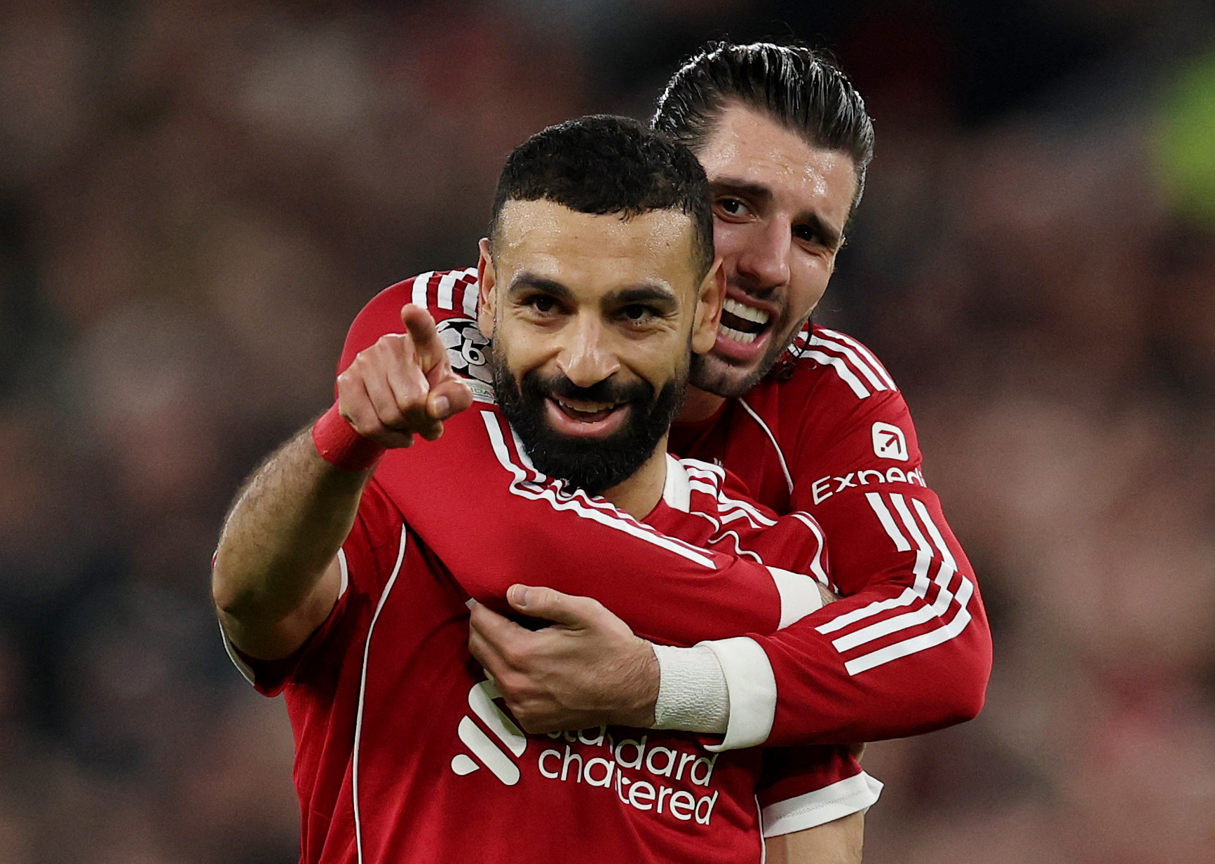 Soccer Football - UEFA Champions League - Round 16 - Second Leg - Liverpool v Galatasaray - Anfield, Liverpool, Britain - March 18, 2026 Liverpool's Mohamed Salah celebrates scoring their fourth goal with Dominik Szoboszlai REUTERS/Phil Noble