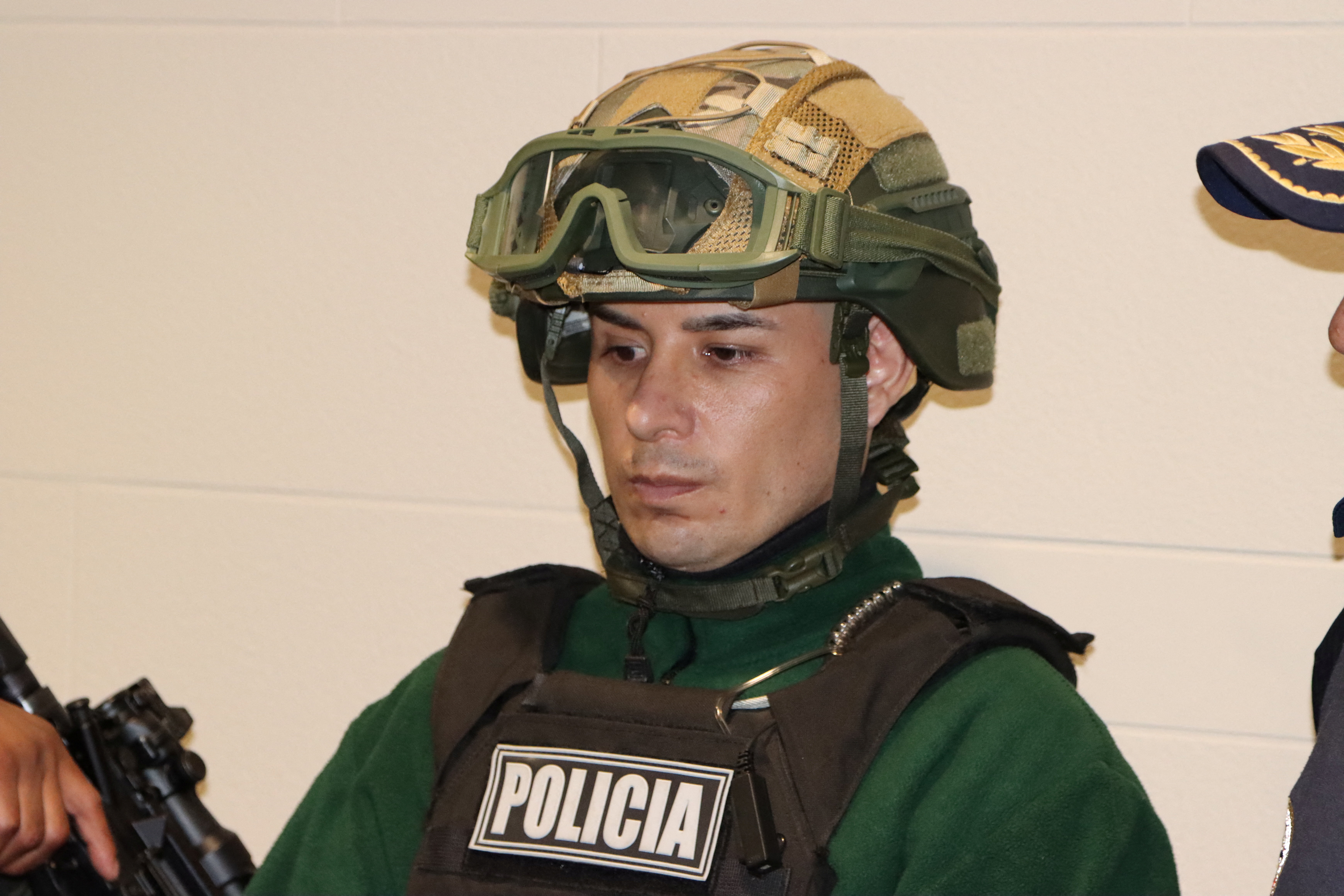 A man identified as Angel Esteban Aguilar, leader of the Ecuadorian criminal group Los Lobos, is photographed after his arrest, who is wanted in connection with the 2023 assassination of Ecuadorean presidential candidate Fernando Villavicencio, at the international airport El Dorado in Bogota, Colombia, March 18, 2026. Colombian Migration/Handout via REUTERS THIS IMAGE HAS BEEN SUPPLIED BY A THIRD PARTY. MANDATORY CREDIT. NO RESALES. NO ARCHIVES. /Handout via REUTERS THIS IMAGE HAS BEEN SUPPLIED BY A THIRD PARTY