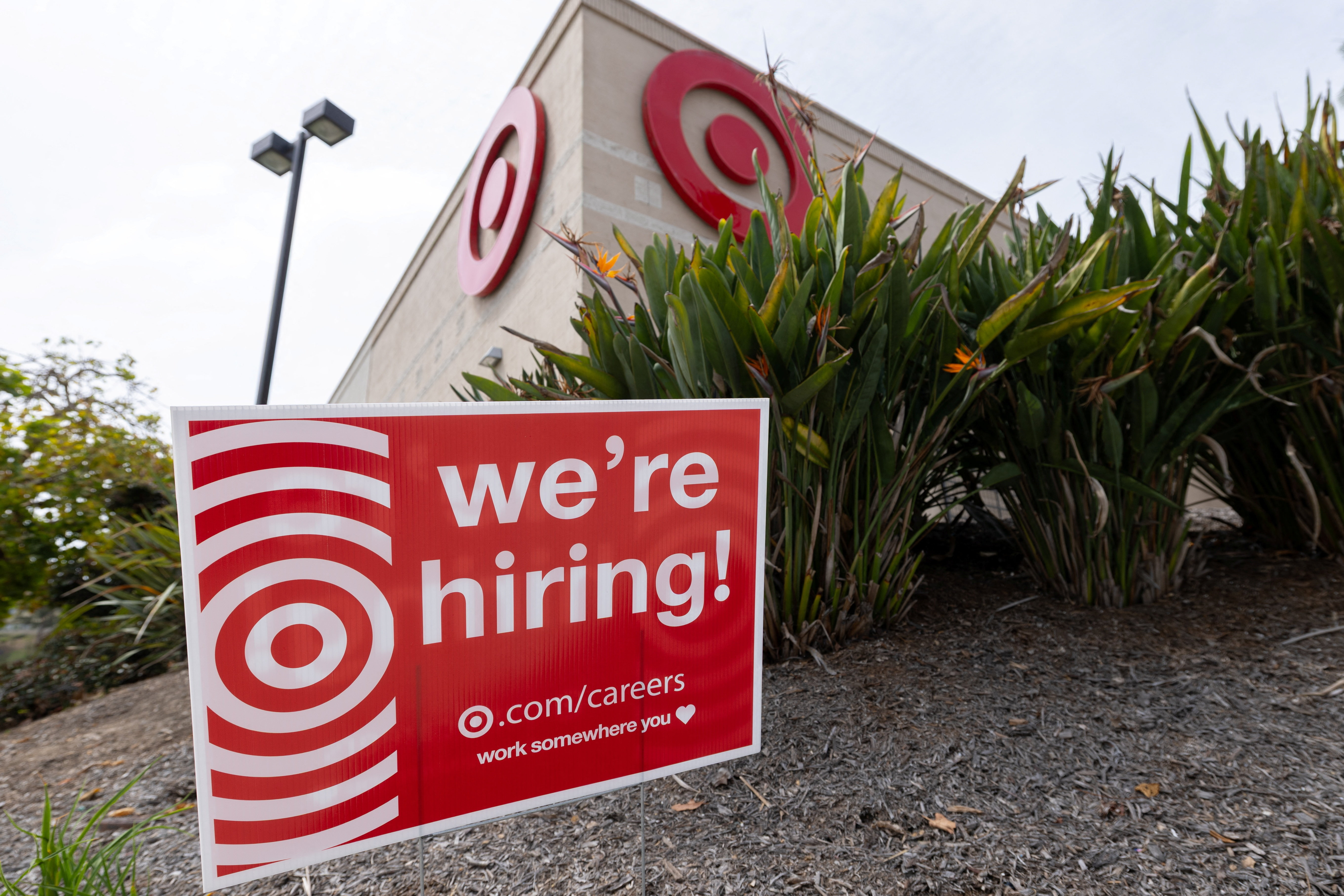 A sign posted outside a Target store states the company is hiring in Encinitas, California, U.S., March 30, 2026. REUTERS/Mike Blake
