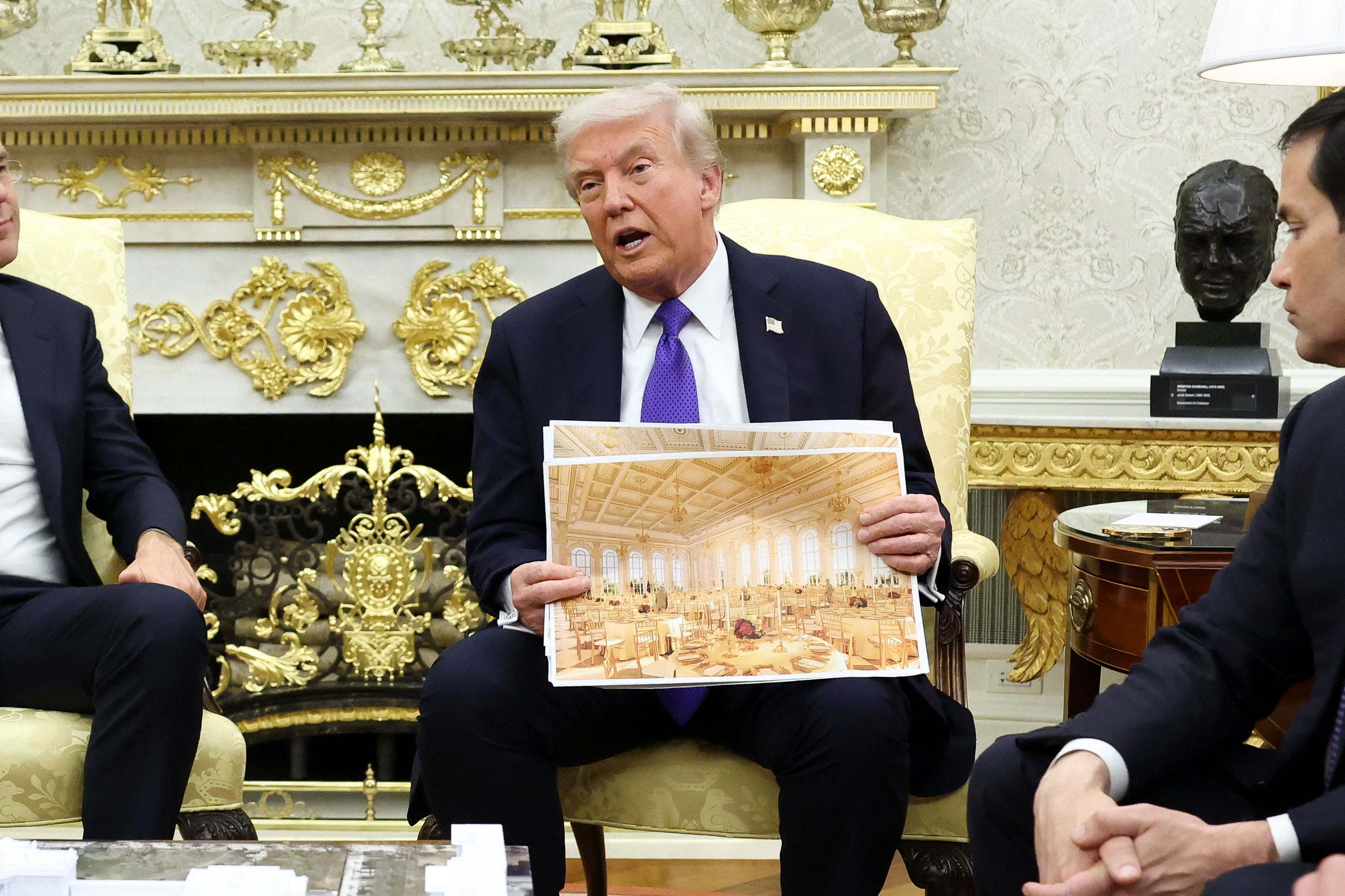 U.S. President Donald Trump holds an image of a rendering of the new White House ballroom to be built in Washington, D.C., U.S., October 22, 2025. [Kevin Lamarque/Reuters]