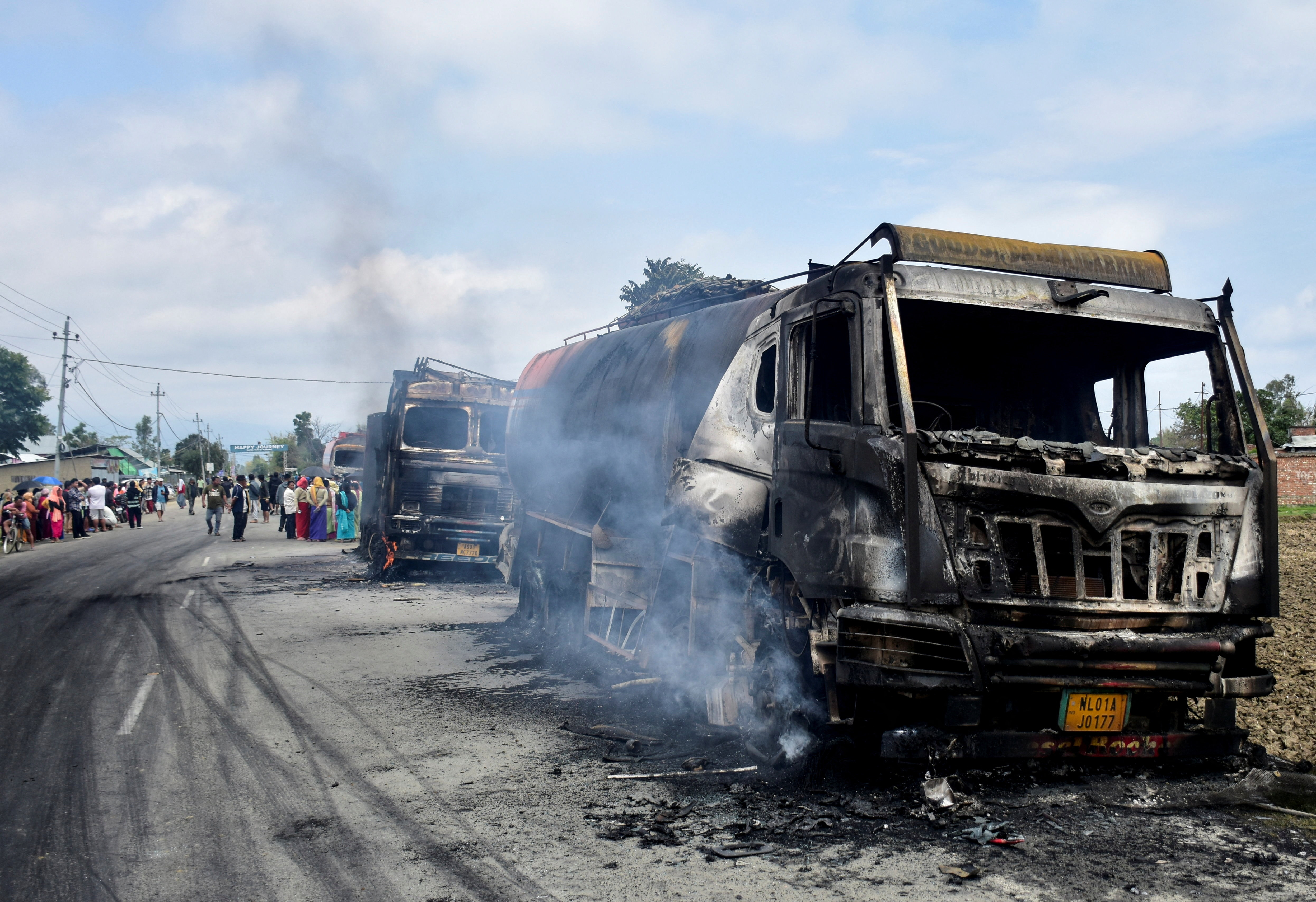 Smoke rises from burned vehicles heading towards Churachandpur district following an attack in Bishnupur district, Manipur, India, April 7, 2026 [Reuters]