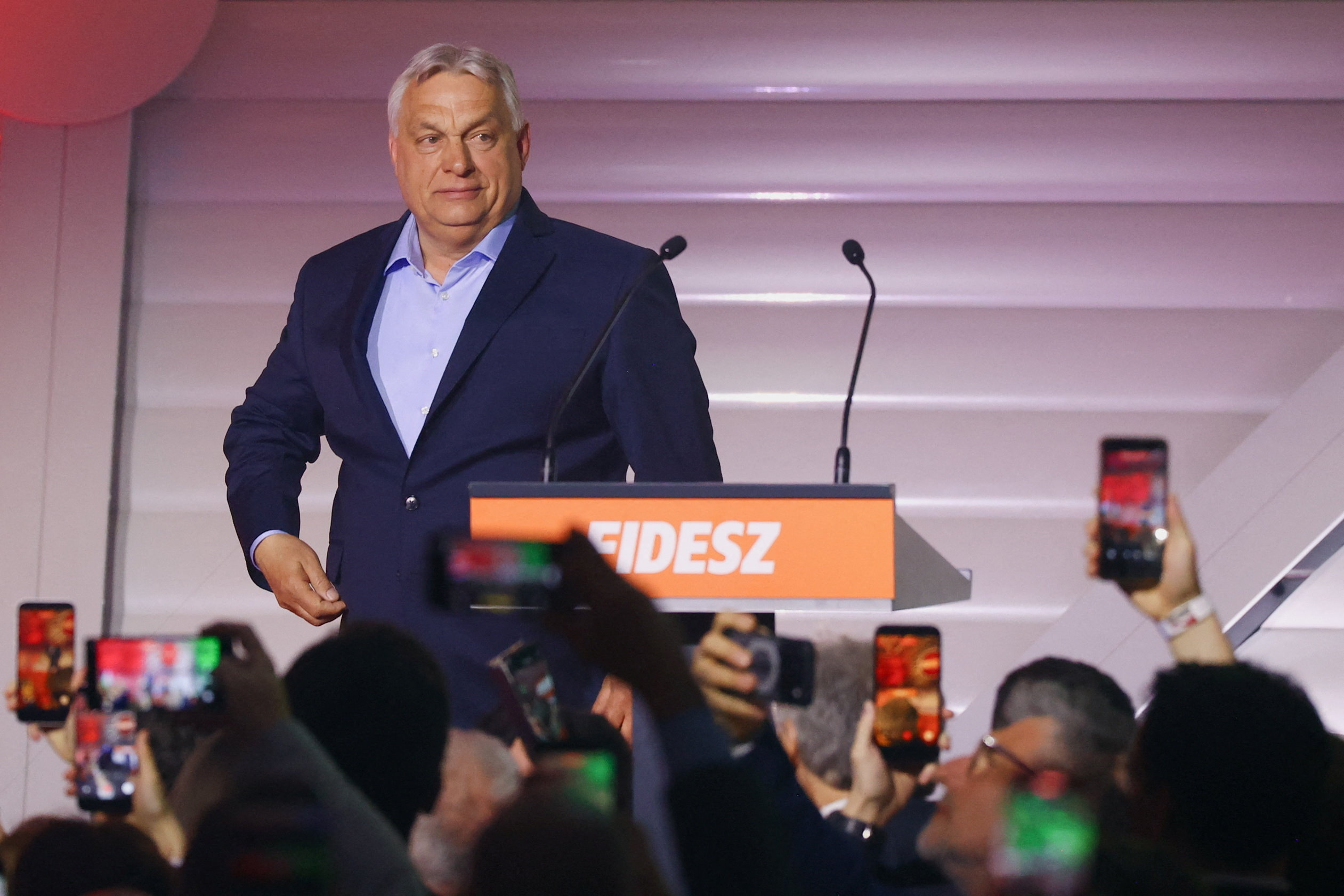 Hungarian Prime Minister Viktor Orban arrives to address supporters after the announcement of the partial results of parliamentary election in Budapest, Hungary, April 12, 2026. REUTERS/Bernadett Szabo