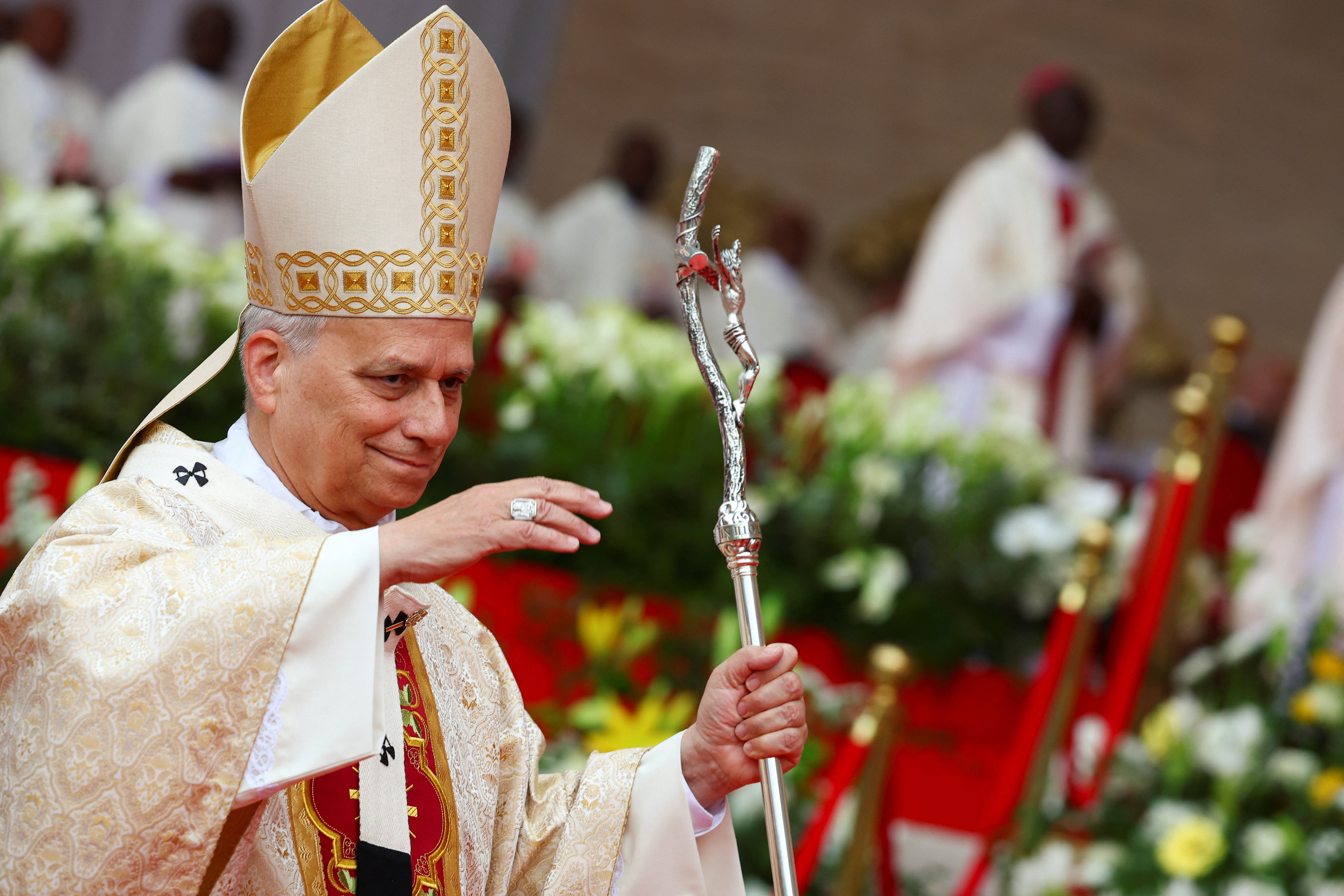 Pope Leo gesturing during a holy Mass at Malabo Stadium