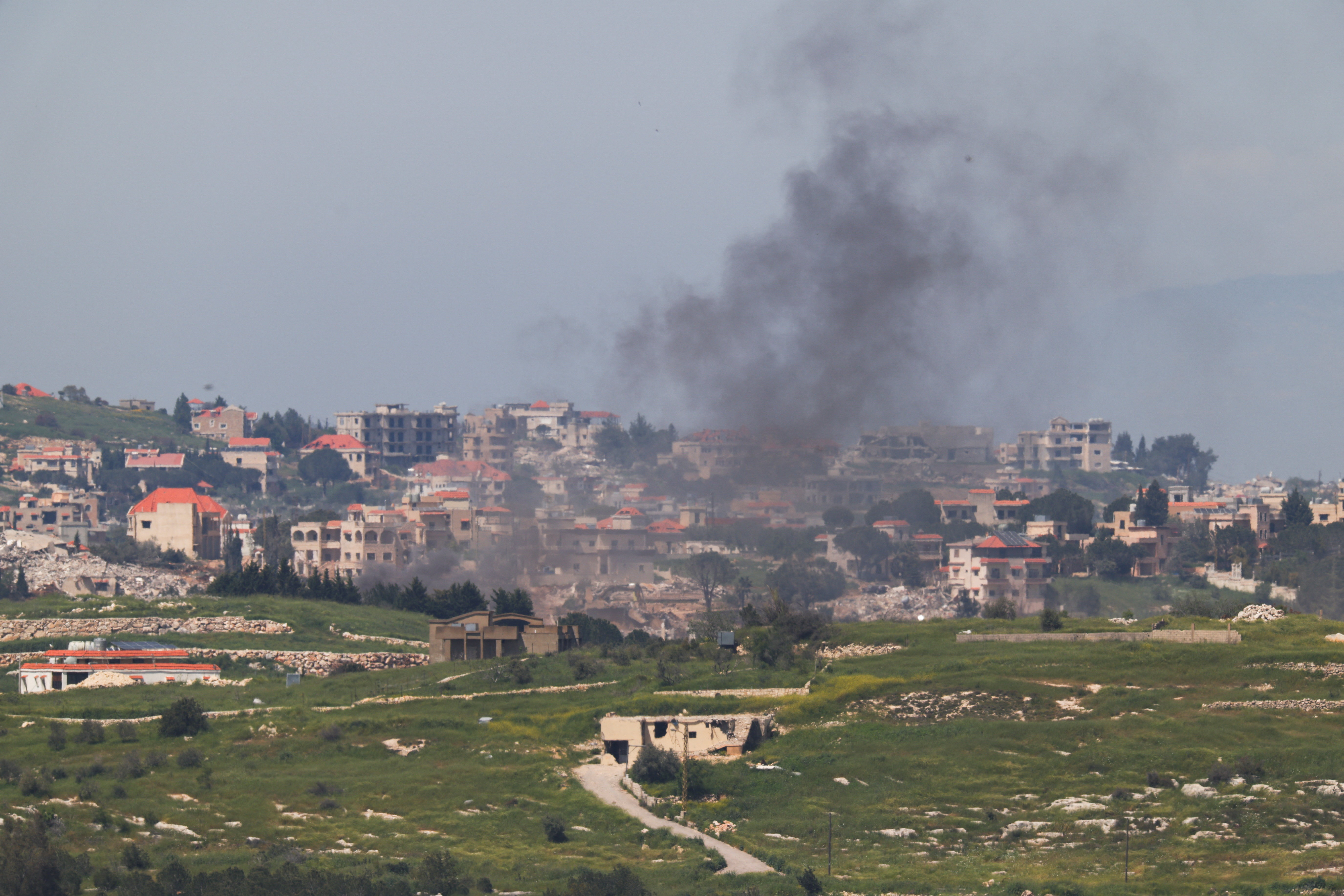 Smoke rising in front of buildings in Lebanon