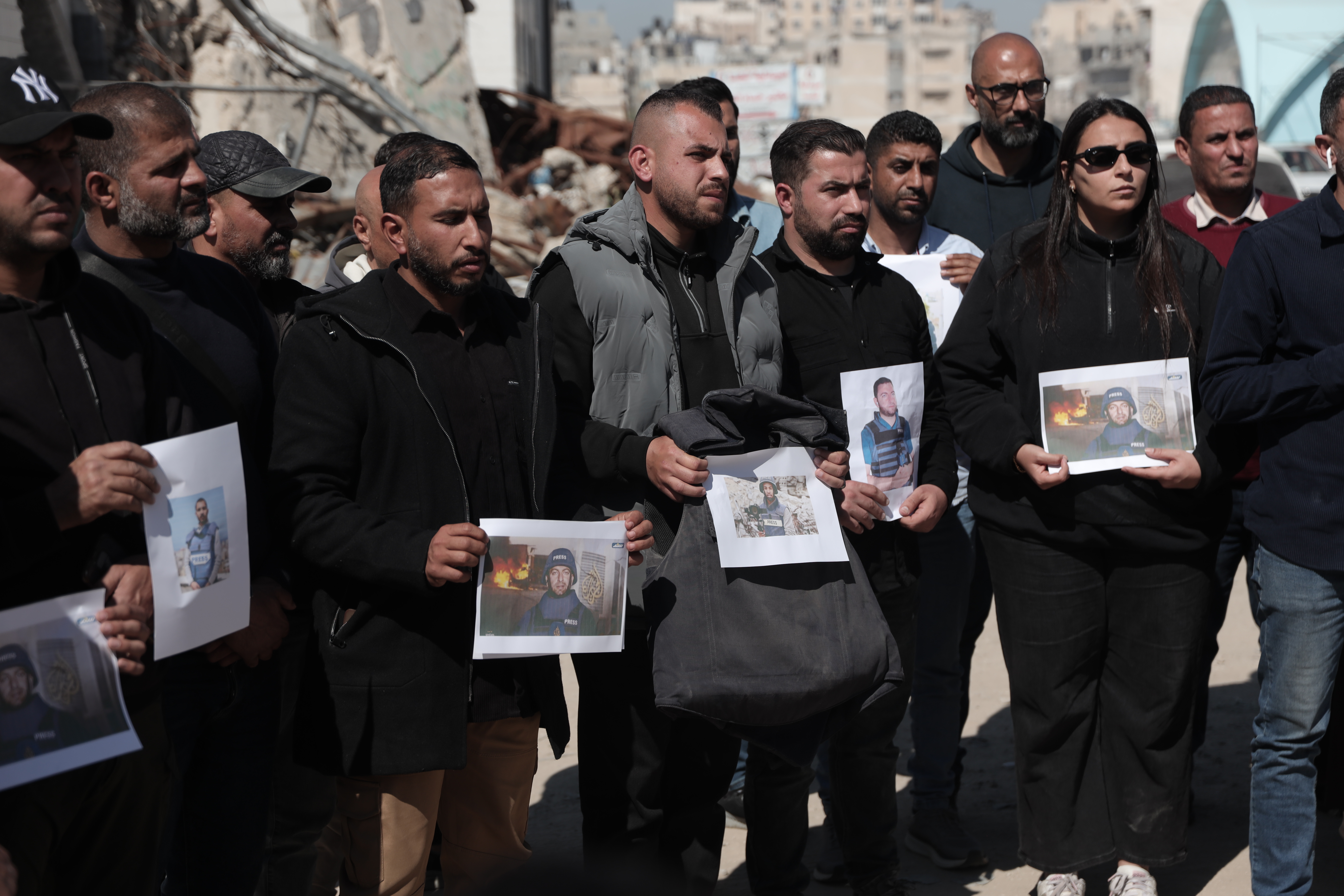 Journalists in Gaza hold a vigil condemning the killing of Al Jazeera Mubasher correspondent Mohammed Wishah and ongoing attacks on media workers [Abdelhakim Abu Riash / Al Jazeera]