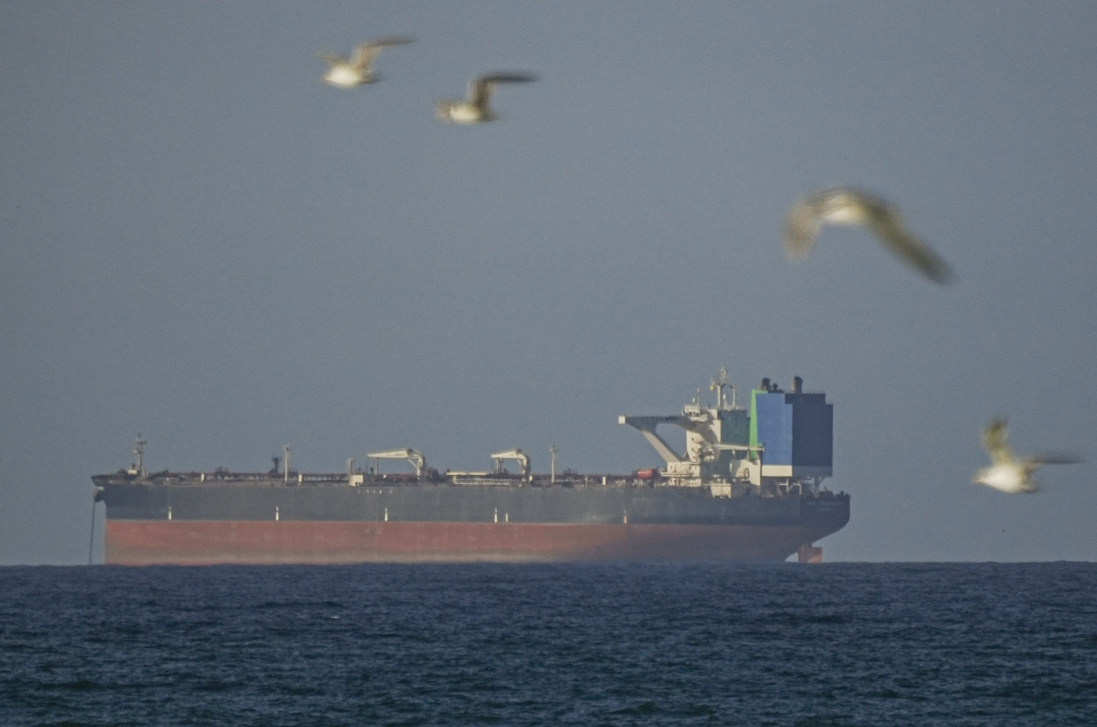 A ship waits to pass through the Strait of Hormuz