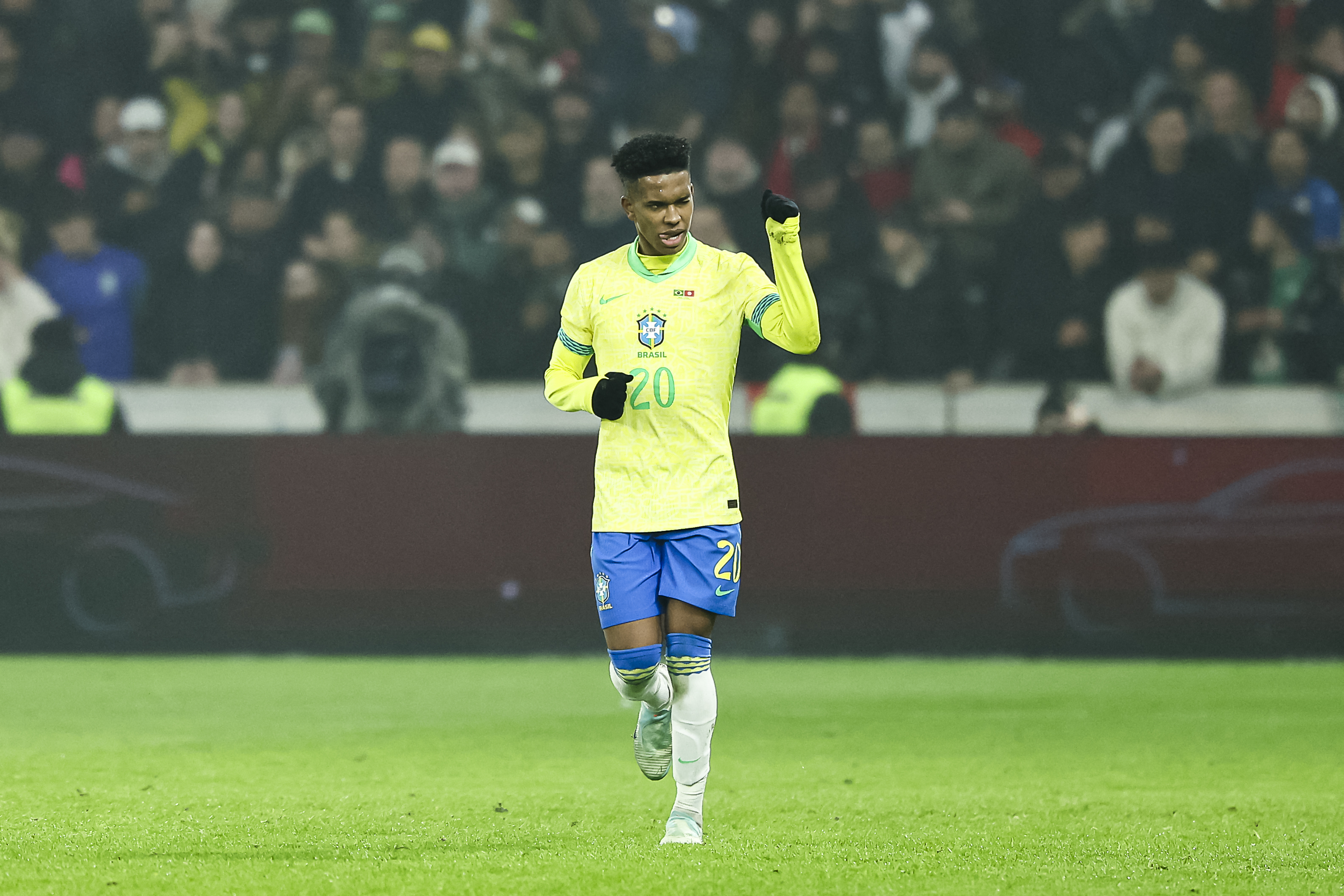 Brazil's forward #20 Estevao celebrates after scoring Brazil's first goal from the penalty spot during the International friendly football match between Brazil and Tunisia at Stade Pierre-Mauroy, in Villeneuve-d'Ascq, northern France, on November 18, 2025. (Photo by Sameer Al-DOUMY / AFP)