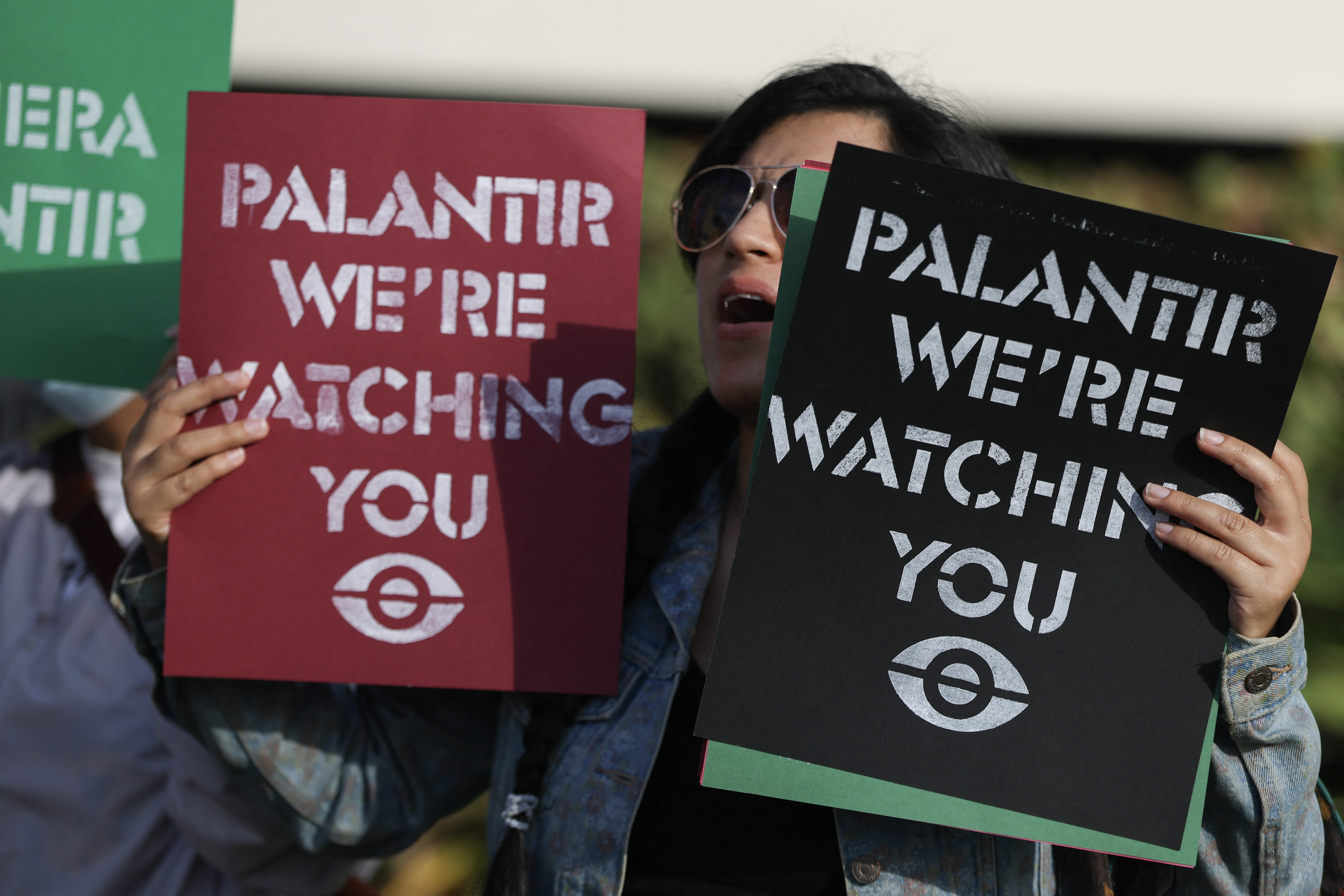 Protesters demonstrate near Palantir's headquarters
