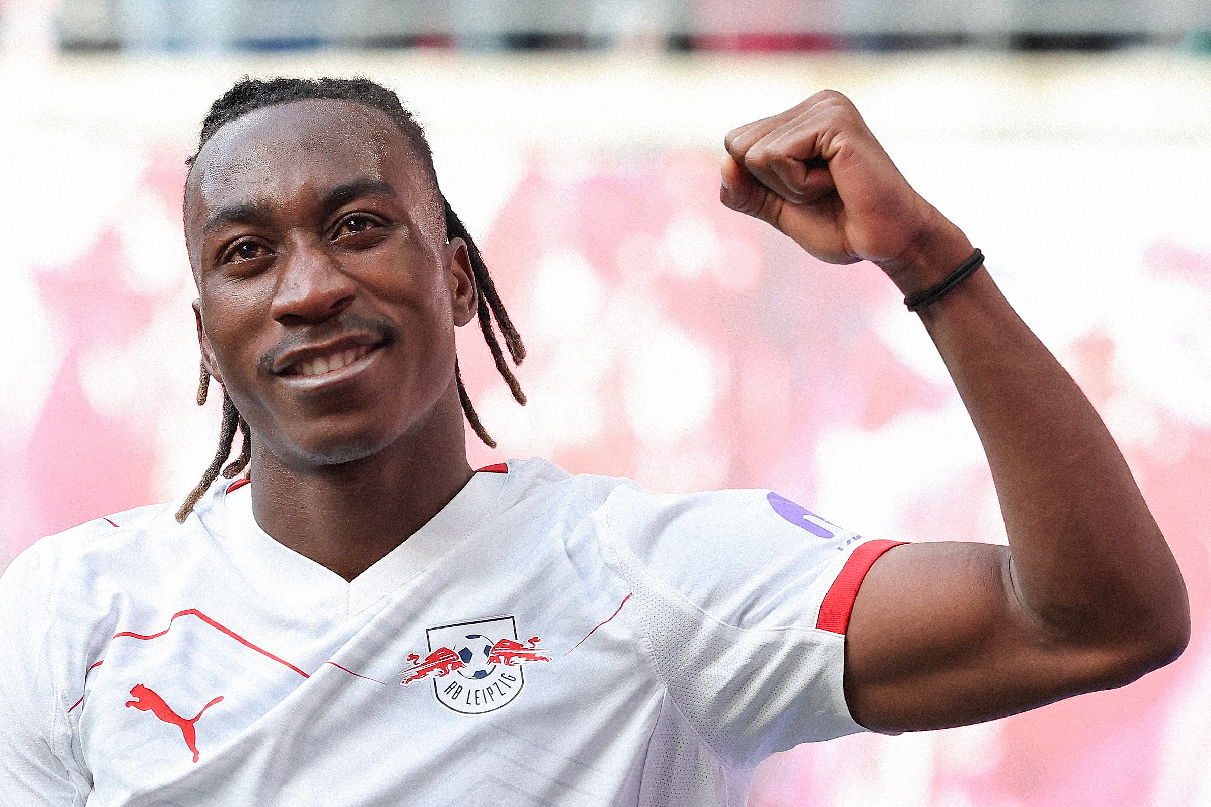 Leipzig's Ivorian forward #49 Yan Diomande celebrates scoring the opening goal during the German first division Bundesliga football match between RB Leipzig and Borussia Moenchengladbach in Leipzig, eastern Germany, on April 11, 2026. (Photo by Ronny HARTMANN / AFP) / DFL REGULATIONS PROHIBIT ANY USE OF PHOTOGRAPHS AS IMAGE SEQUENCES AND/OR QUASI-VIDEO ALTERNATIVE CROP