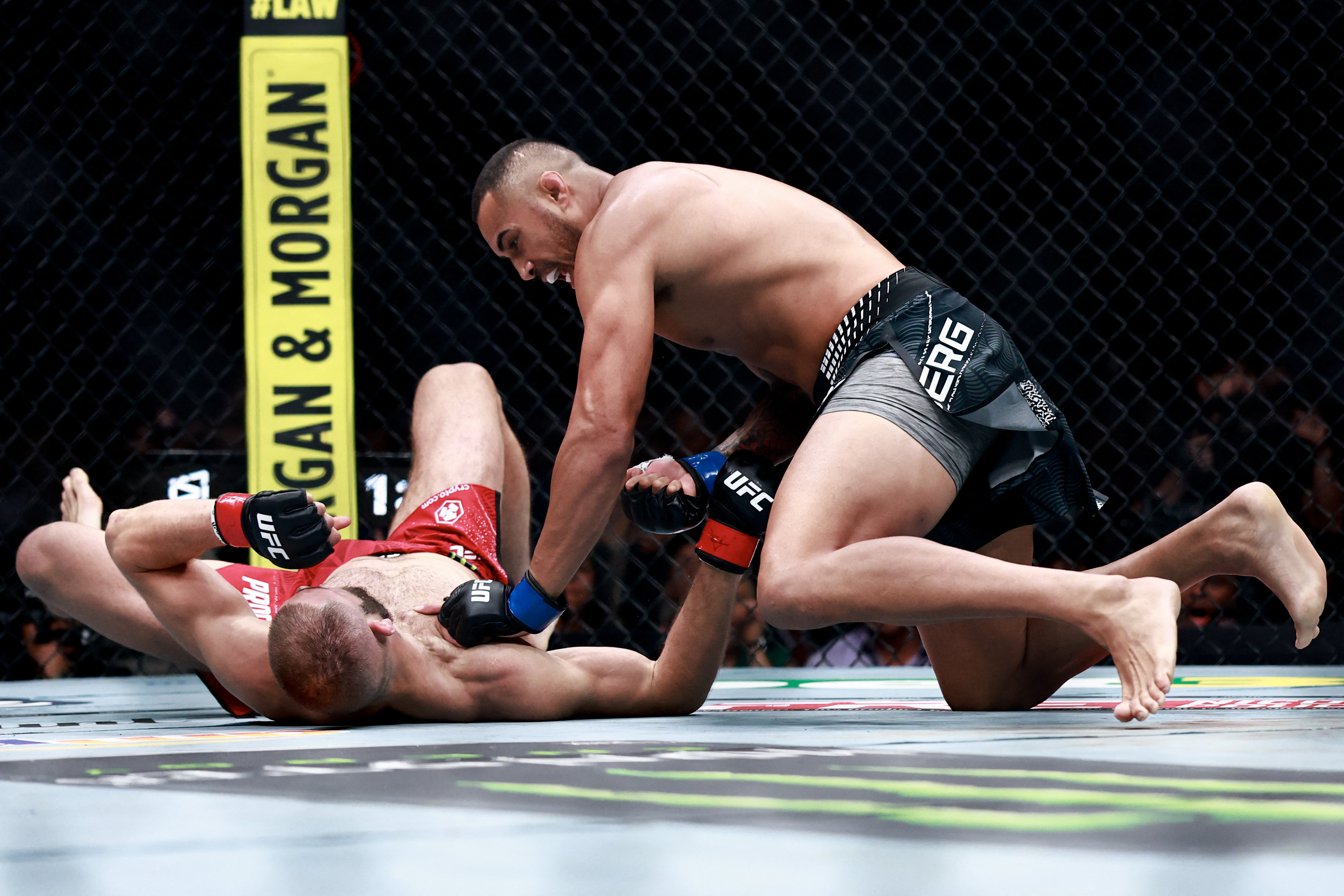 MIAMI, FLORIDA - APRIL 11: Carlos Ulberg of New Zealand, (R), punches Jiri Prochazka of Czechia in a light heavyweight title bout during UFC 327 at the Kaseya Center on April 11, 2026 in Miami, Florida. Carmen Mandato/Getty Images/AFP (Photo by Carmen Mandato / GETTY IMAGES NORTH AMERICA / Getty Images via AFP)