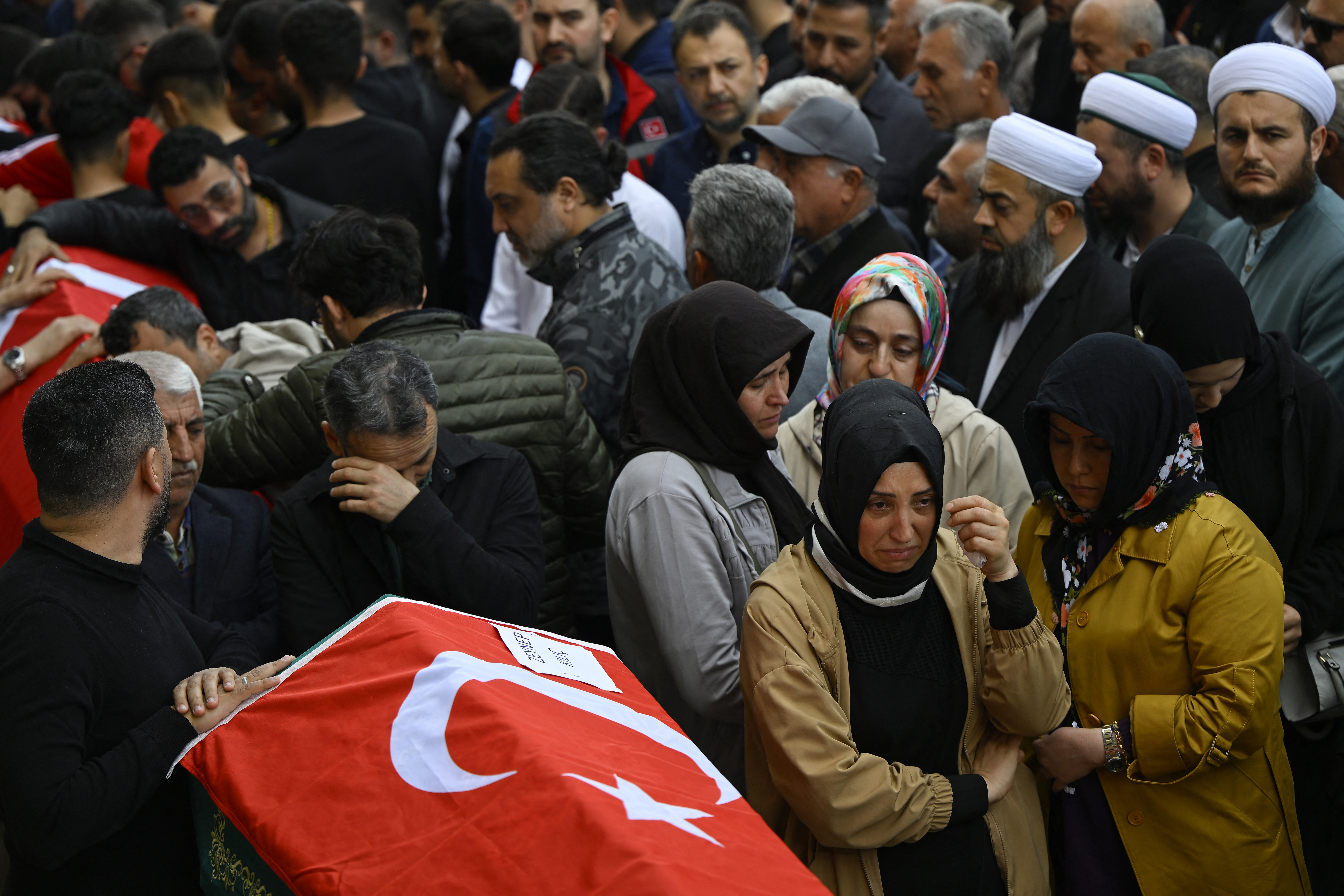 Family members and mourners attend the funerals for nine victims killed in a school shooting by a 14-year-old in Turkiye