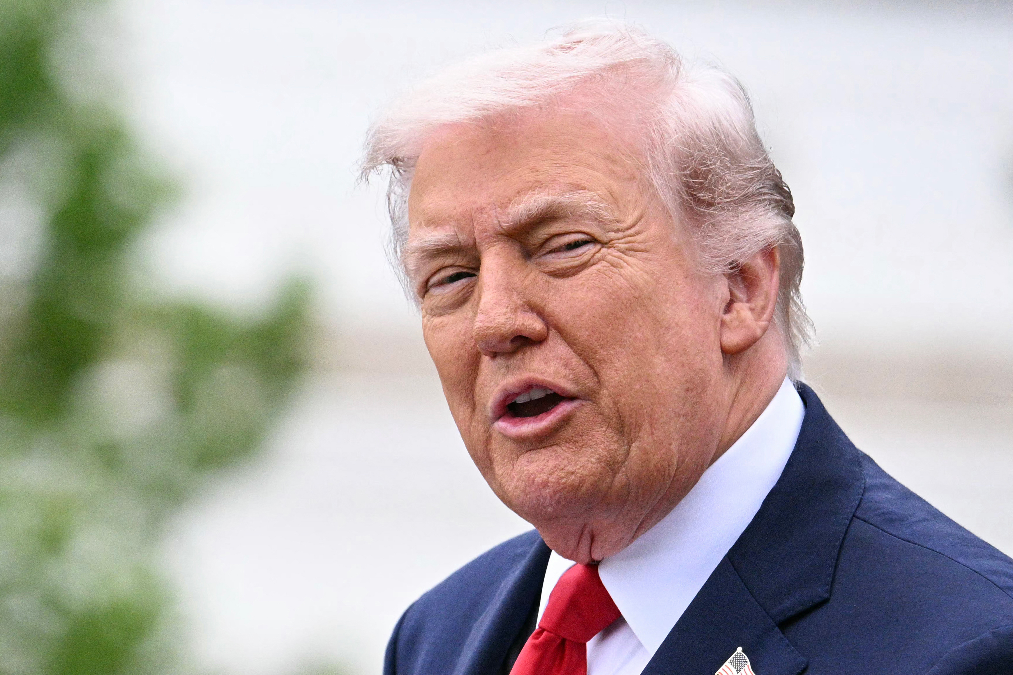 US President Donald Trump speaks during an arrival ceremony on the South Lawn of the White House in Washington, DC, on April 28, 2026. (Photo by Jim WATSON / AFP)